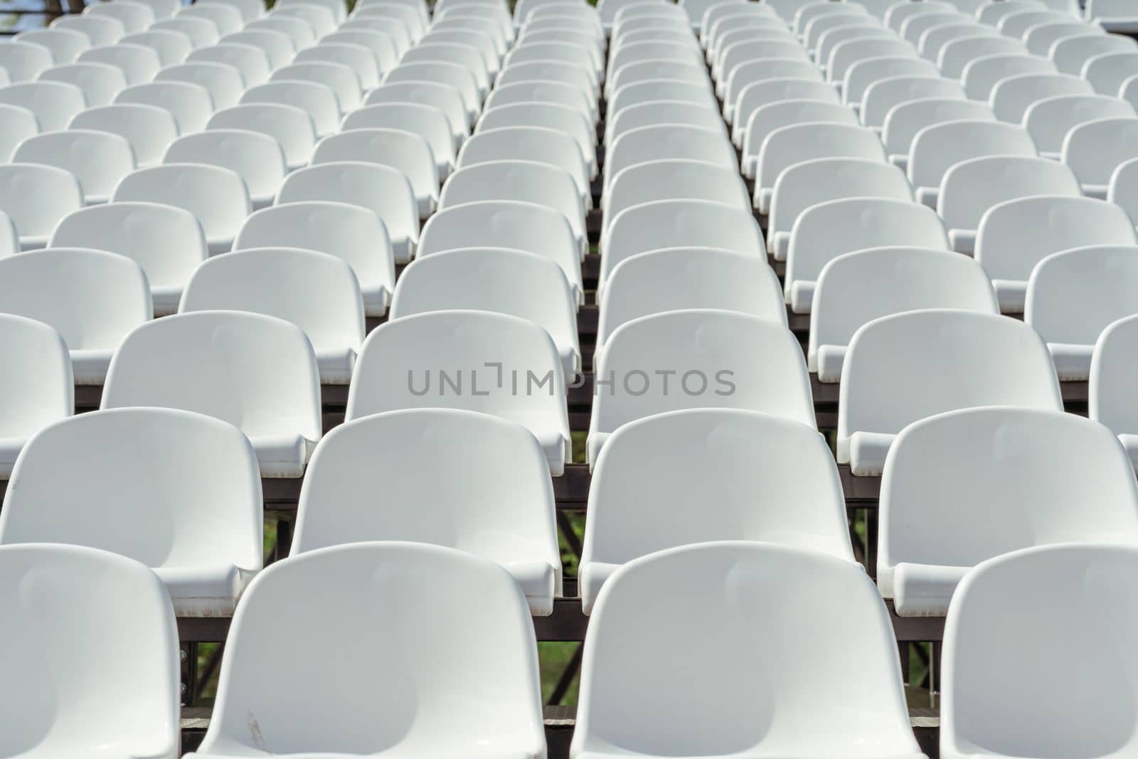 Seats of tribune on sport stadium. Concept of fans, chairs for audience, cultural environment concept. mpty seats, modern stadium