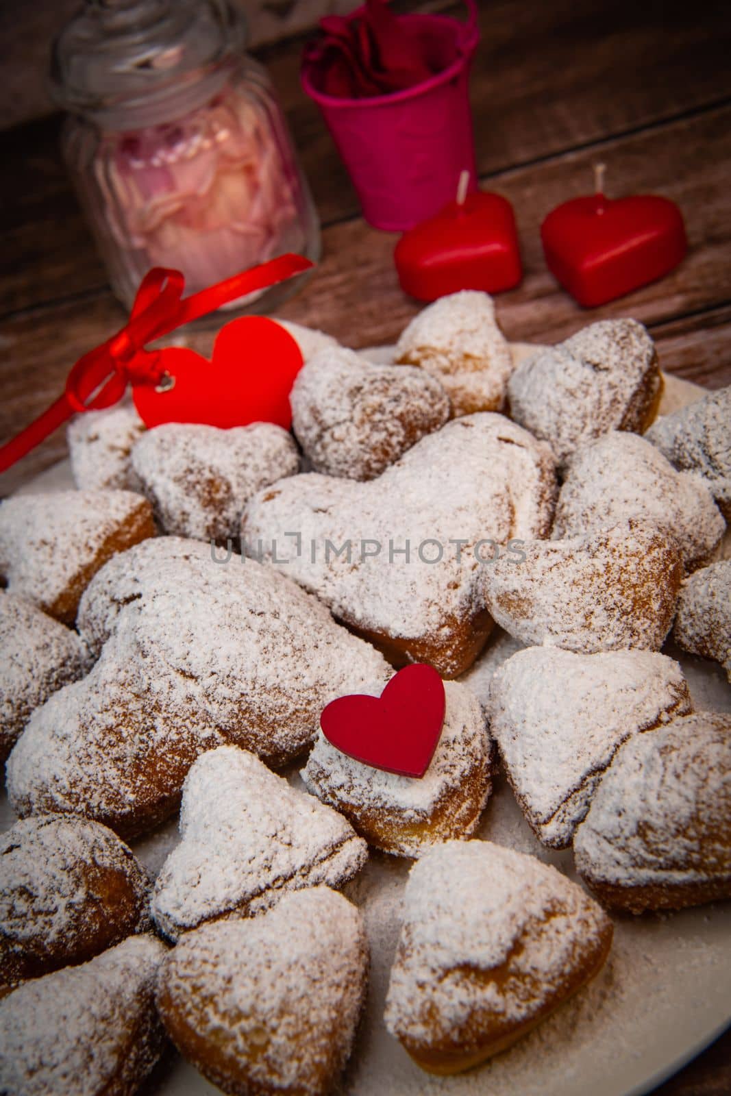 Recipe for soft heart-shaped doughnuts for Valentine's Day. High quality photo