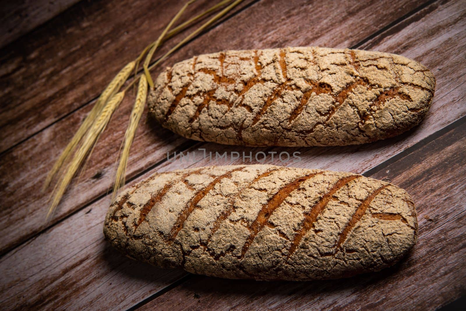 Rye bread on brown background. High quality photo