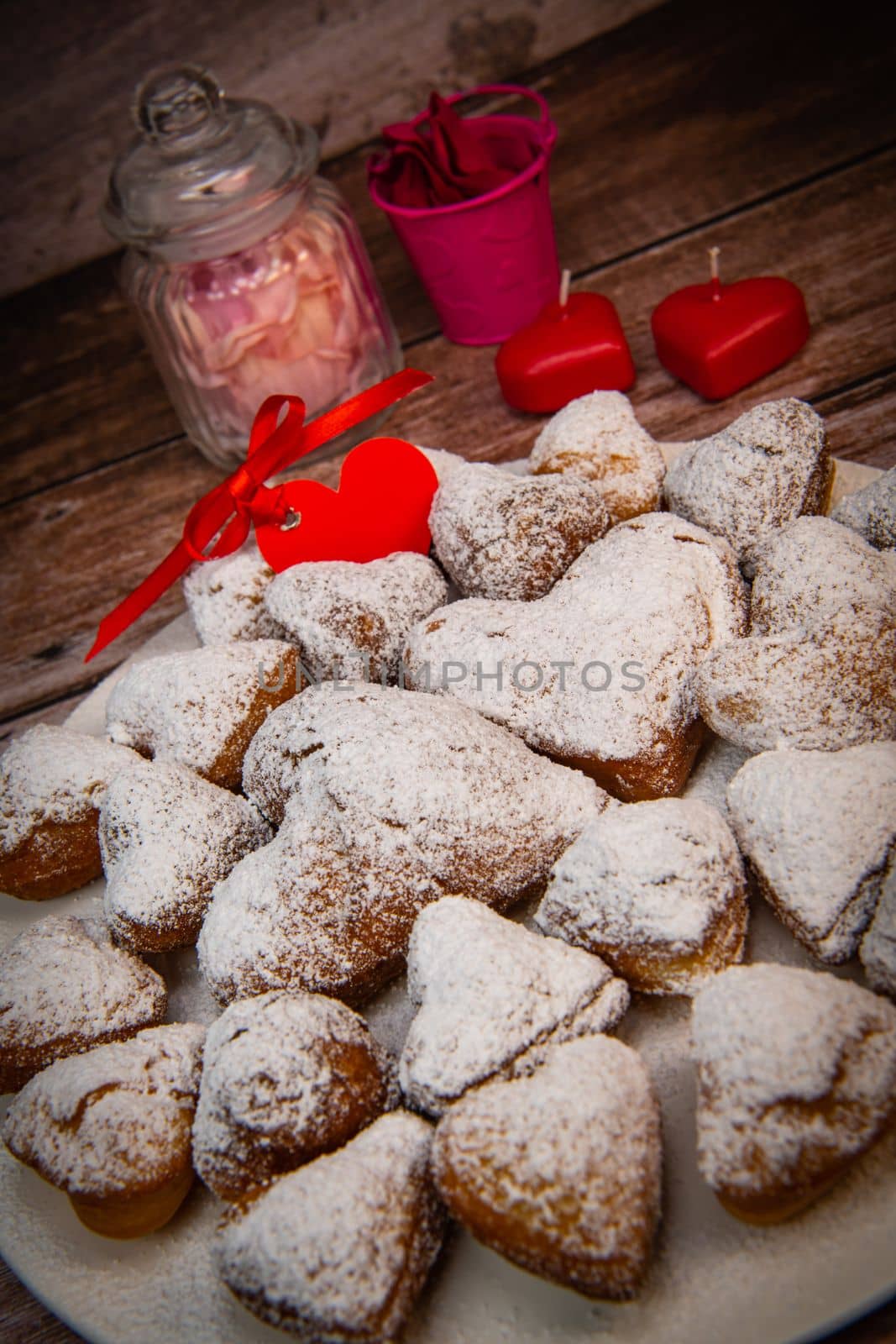 Recipe for soft heart-shaped doughnuts for Valentine's Day. High quality photo