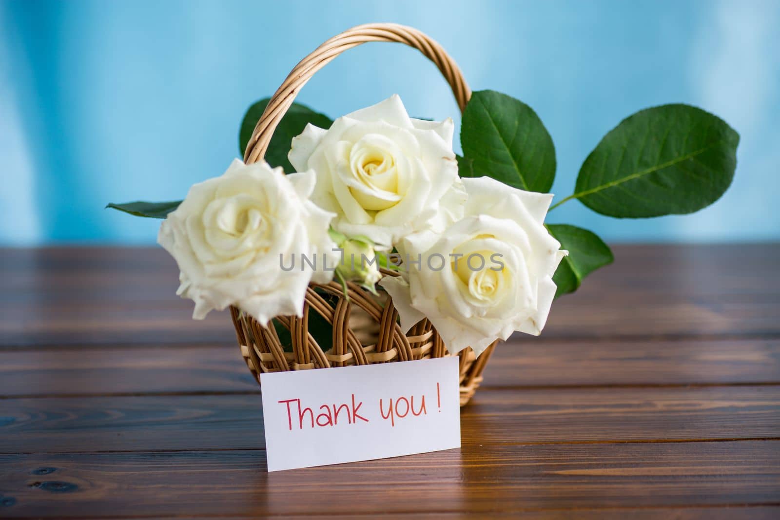 bouquet of beautiful white roses on a wooden table