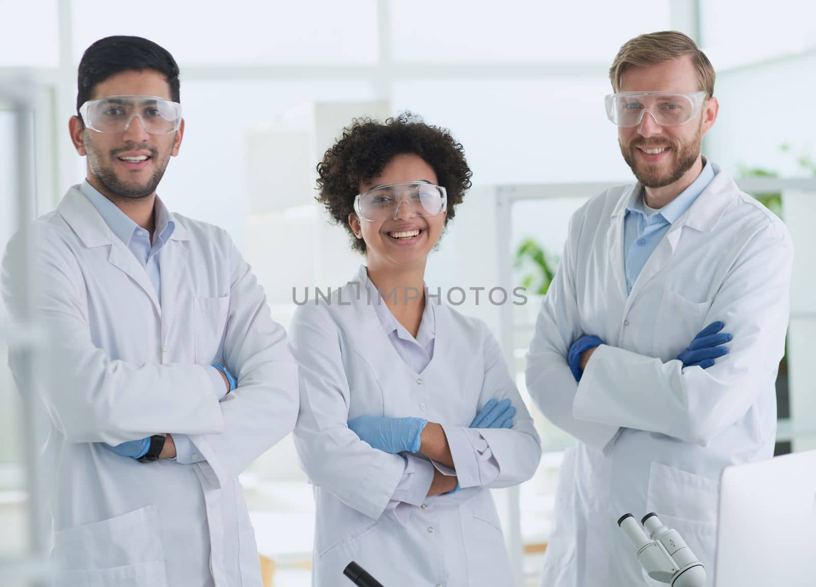 Scientists smiling together in lab