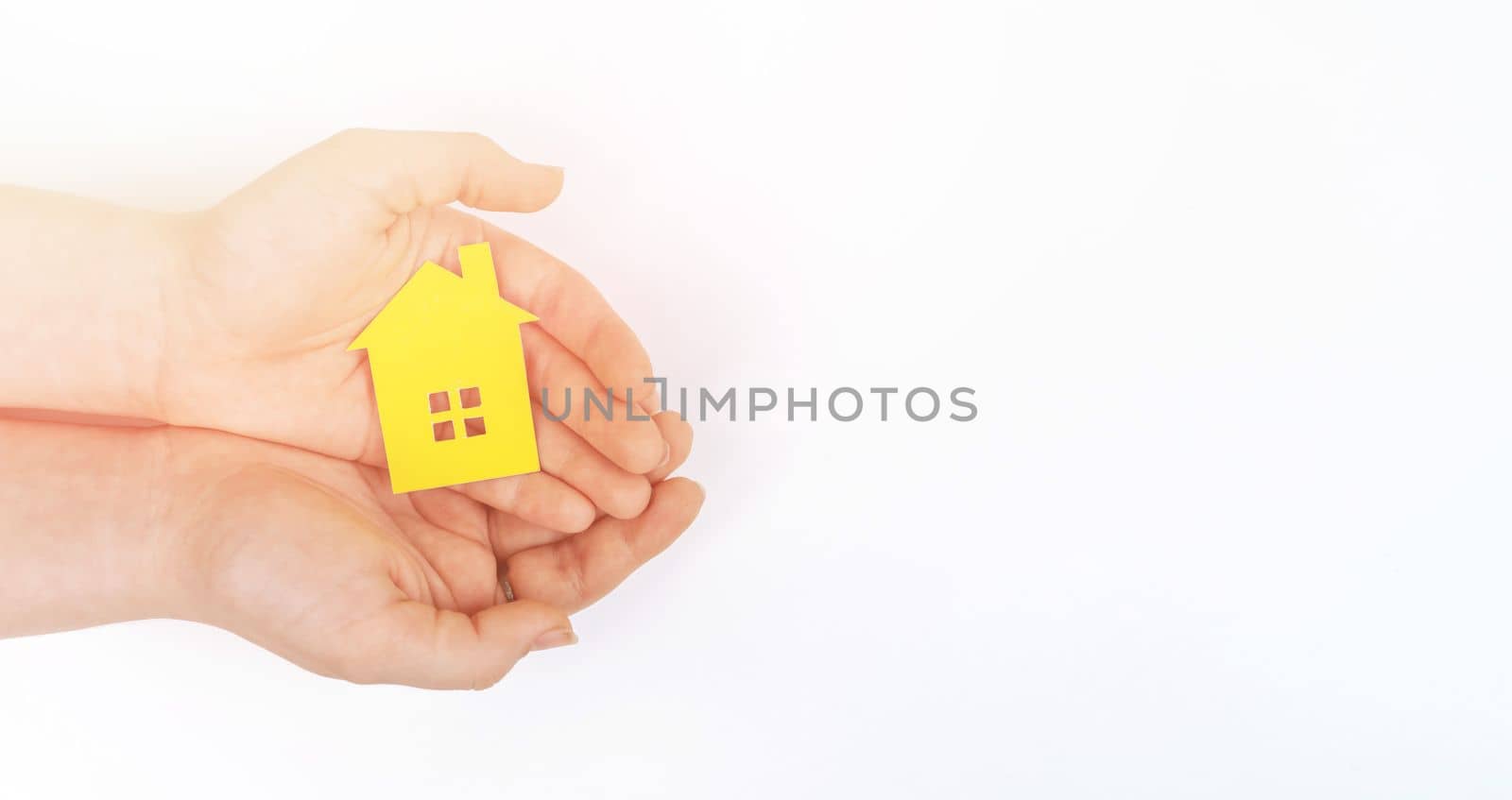 hands holding paper house, family home, homeless housing, mortgage crisis and home protecting insurance concept, foster home care, family day care, social distancing