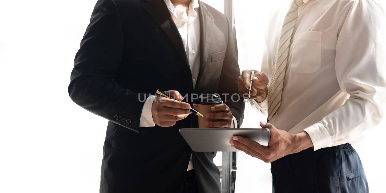 Group of business people busy discussing financial matter during meeting. Corporate Organization Meeting Concept.