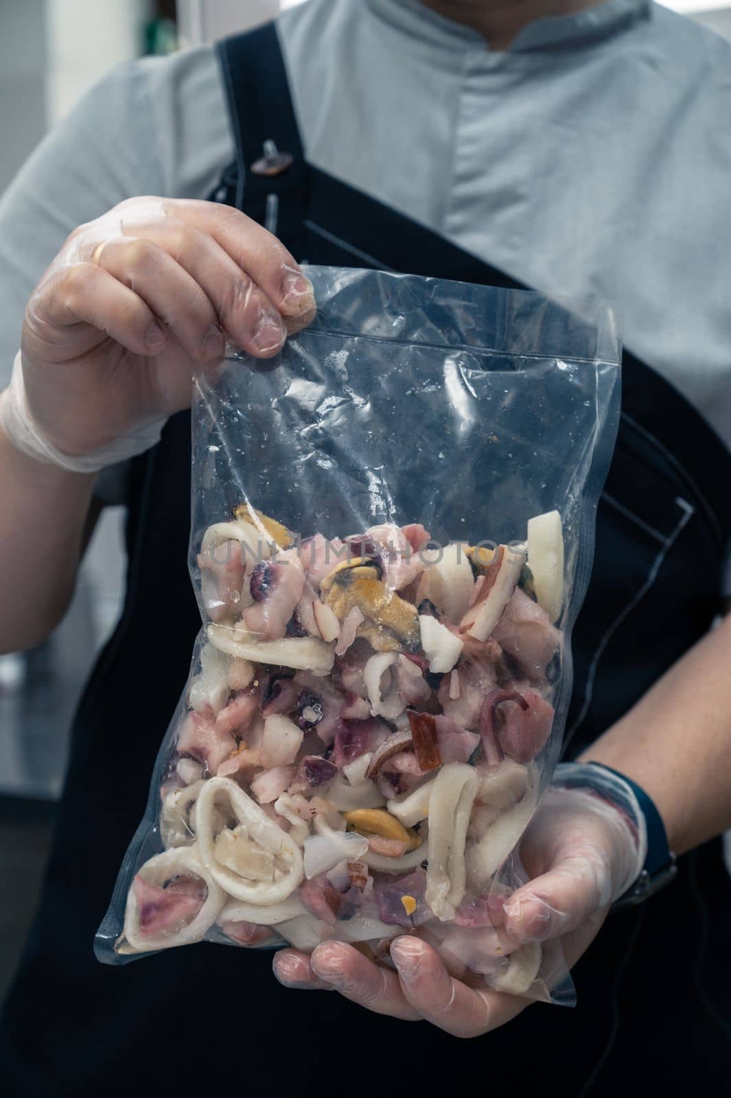 Pack of frozen seafood in hand