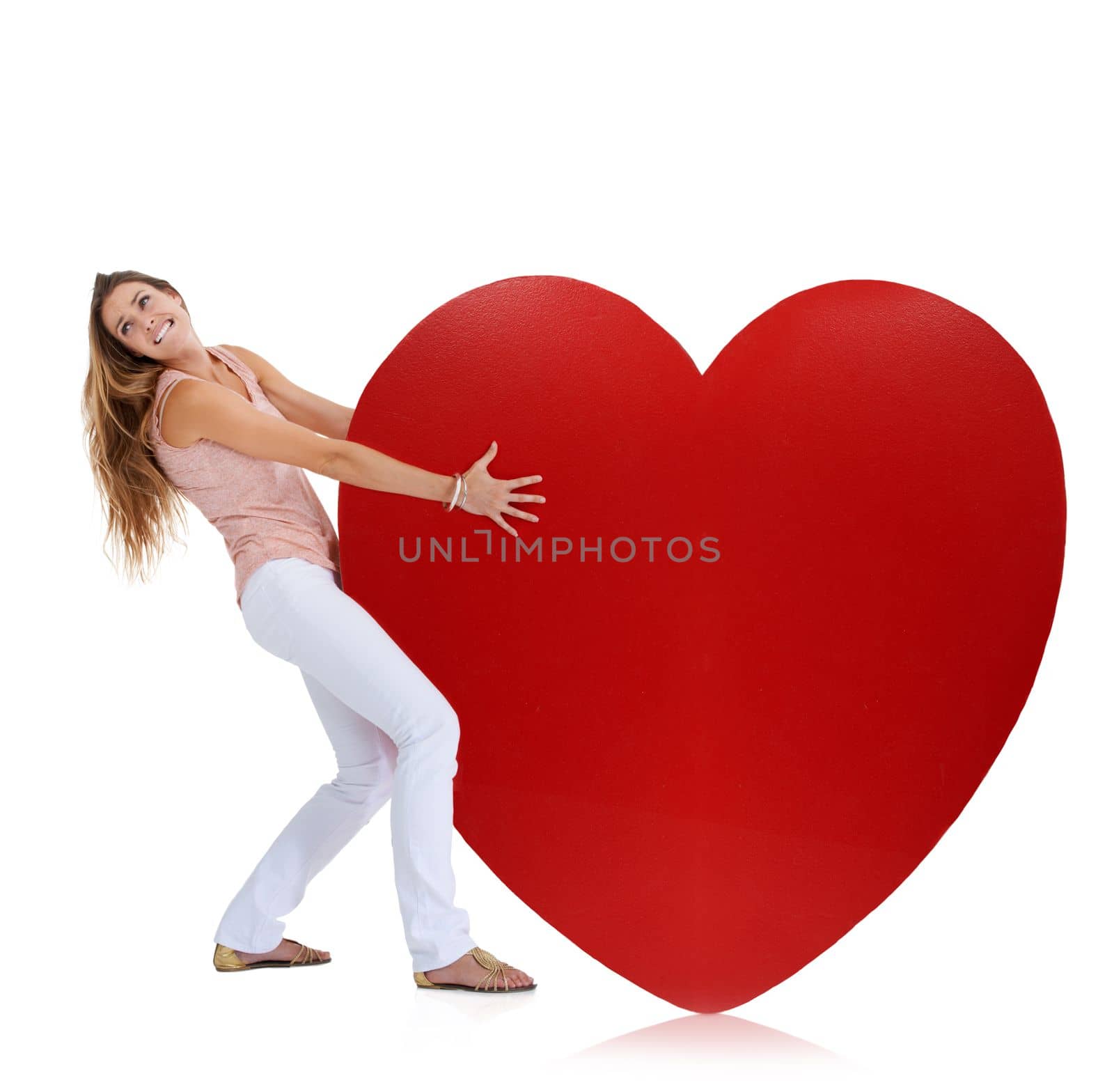 Love, studio and woman pull heart isolated on a white background. Beauty, fashion and young female model pulling heavy symbol or sign for romance emoji, affection or romantic passion, care or empathy by YuriArcurs