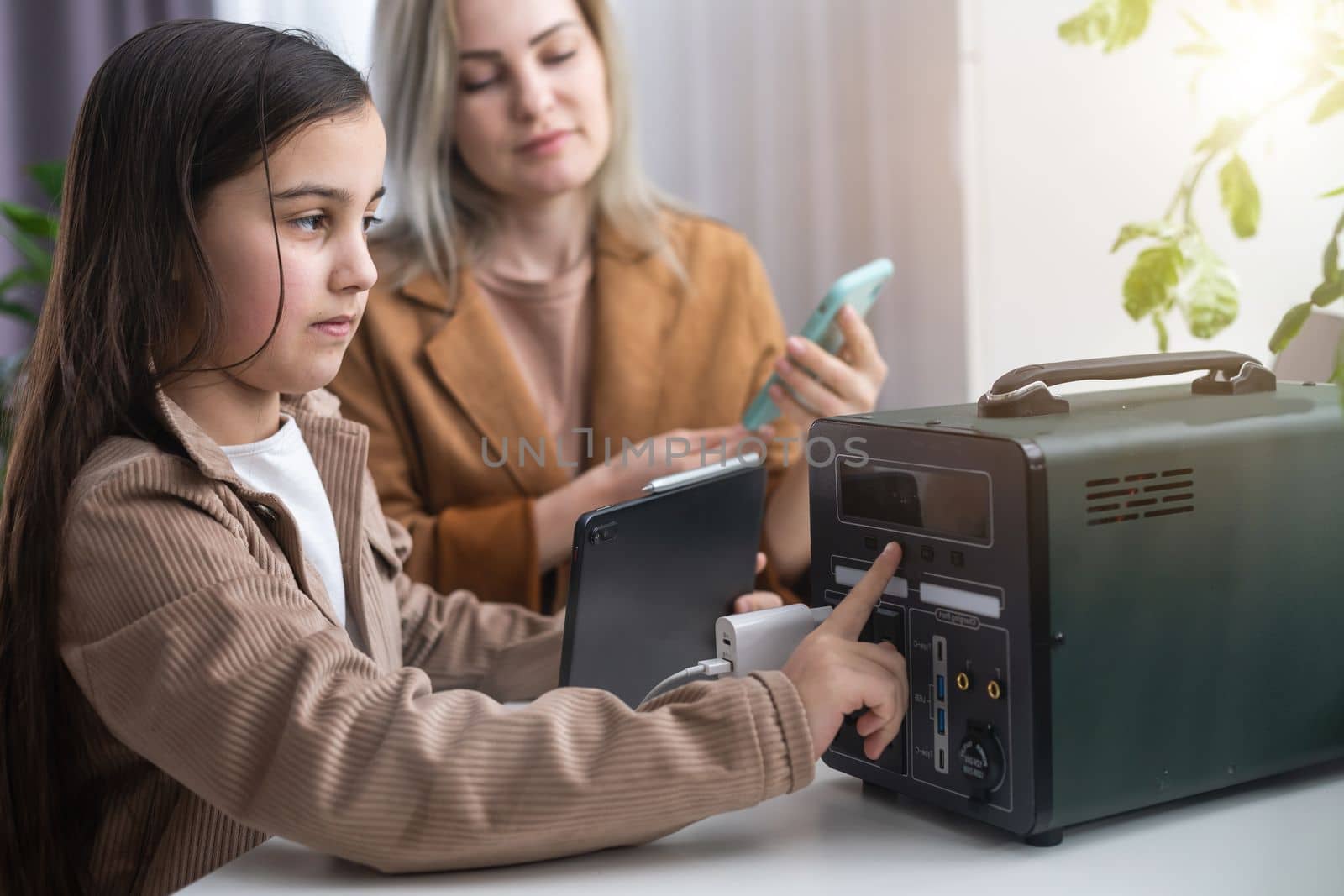 The inverter generator charges the power bank battery.