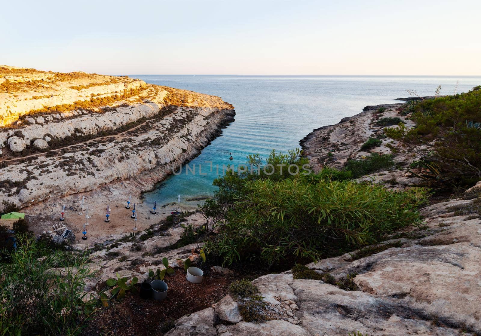 LAMPEDUSA, ITALY - JULY, 29: View of Cala Greca at sunset in the summer season on July 29, 2018
