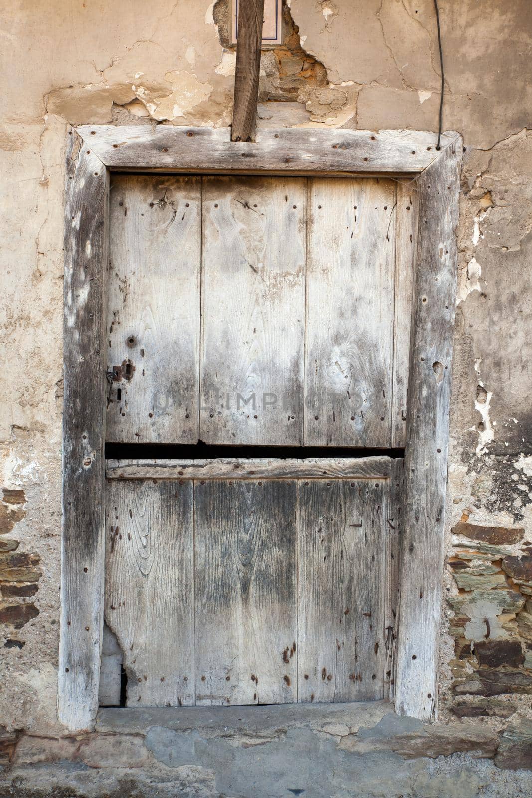 View of old door of rural house in Vilafranca del Bierzo, Spain