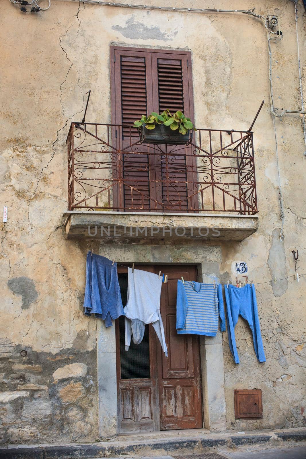 Clothes hanging to dry on a clothes-line next to the door