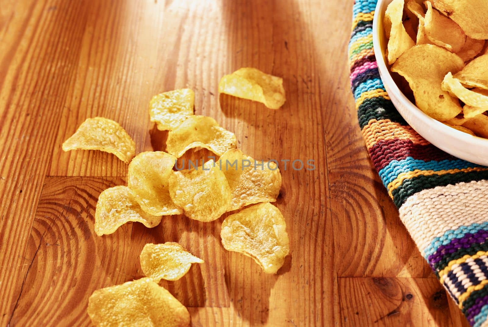 Potato chips on wooden table and in bowl  ,party time
