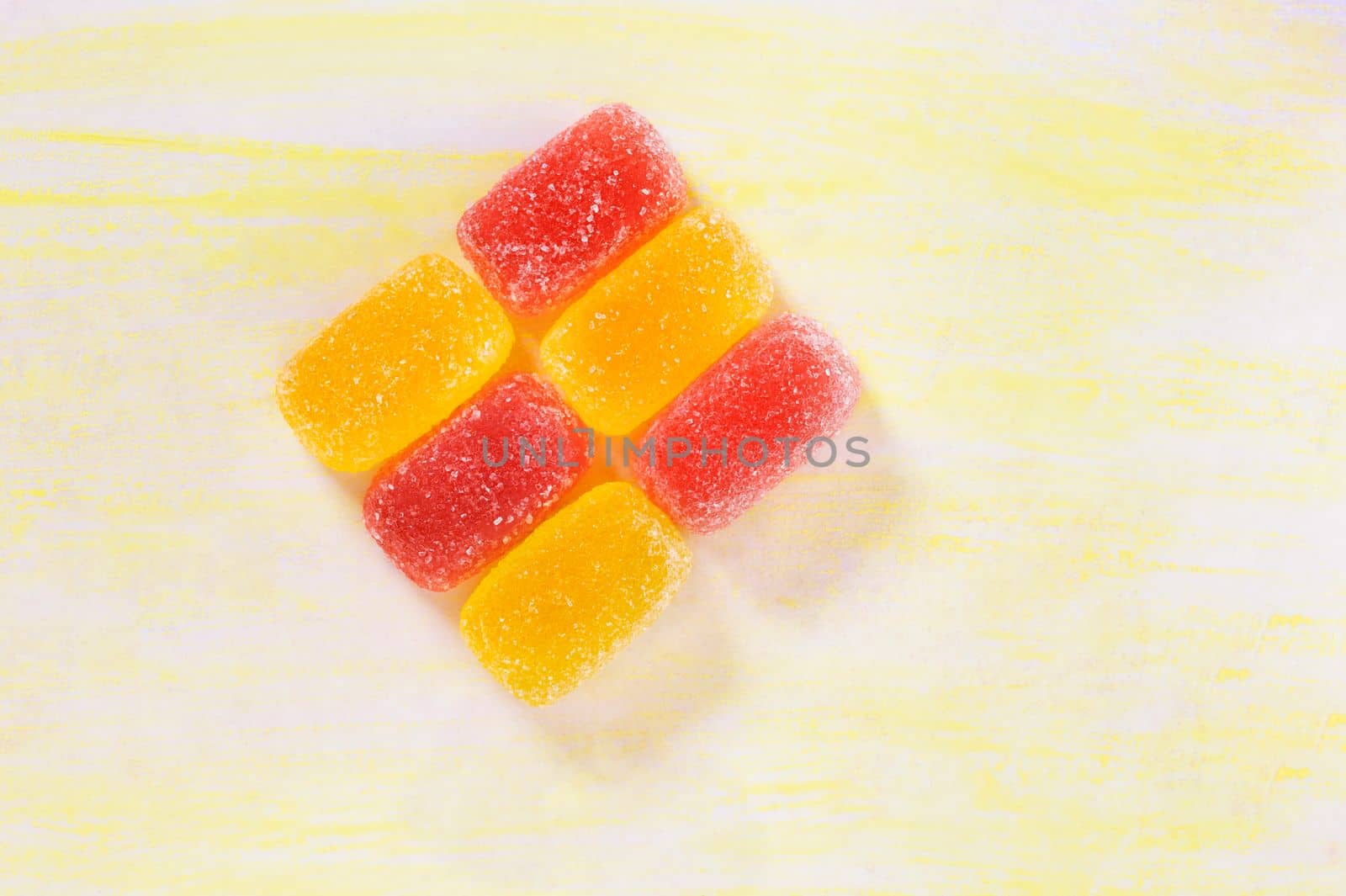 Red and yellow sugar fruit candies ,ready to eat unhealthy sweets