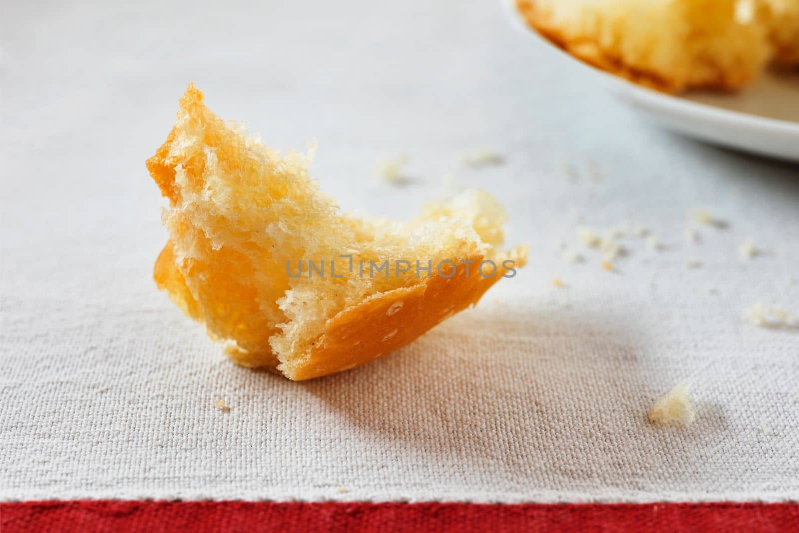 Small cake crumb on white cloth , ready to eat