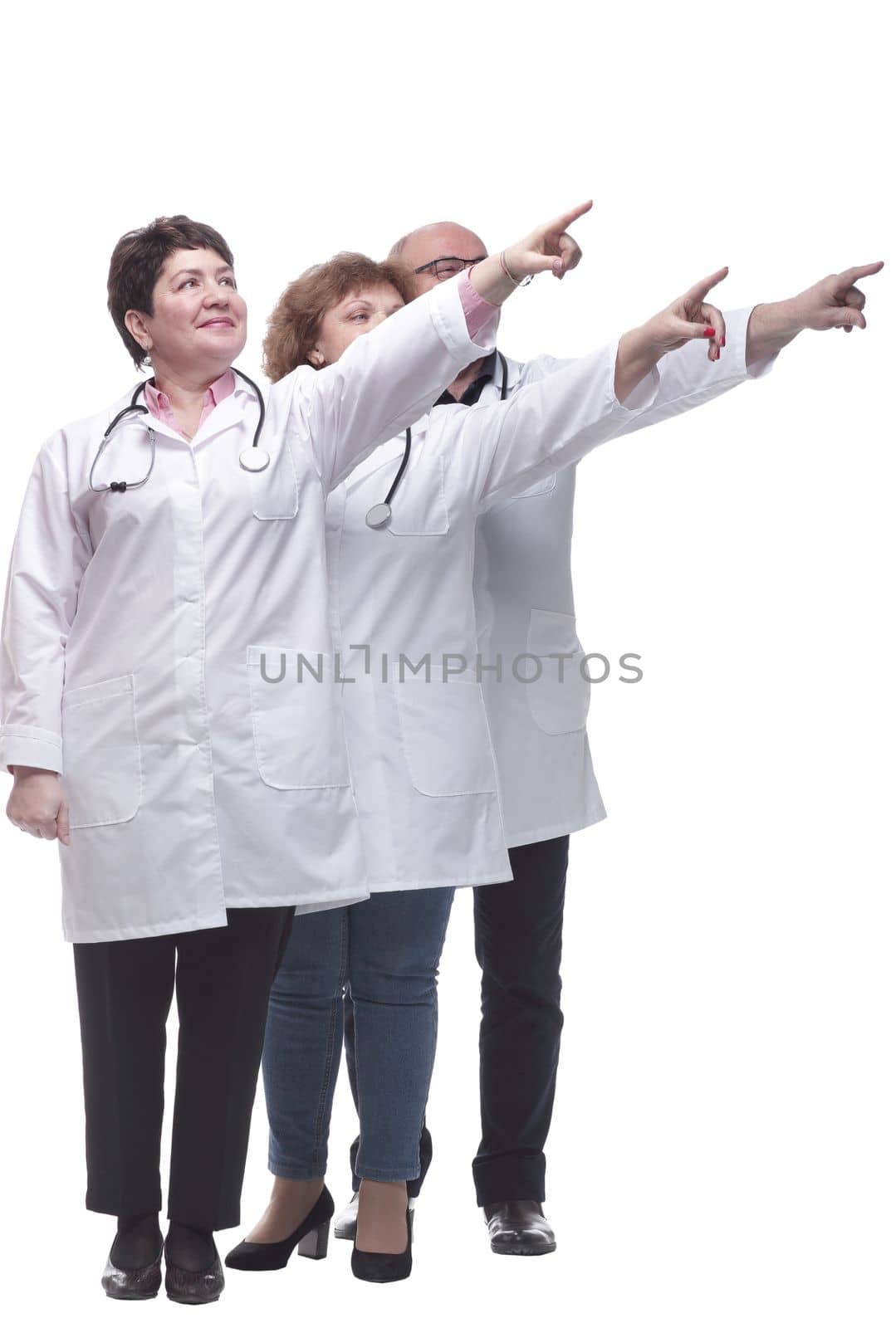 in full growth. group of medical colleagues standing in a row. isolated on a white background