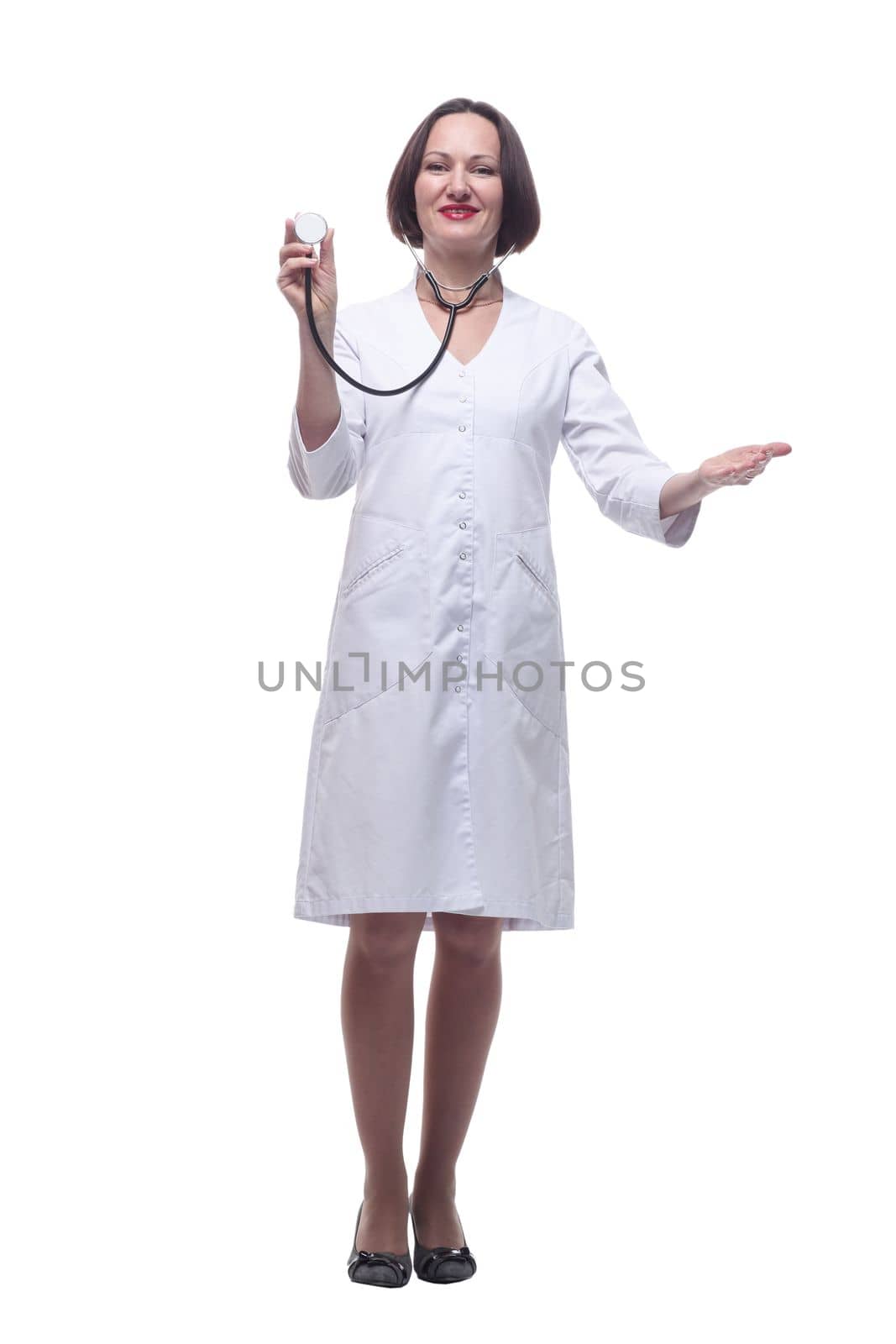 in full growth. confident female doctor holds her stethoscope . isolated on a white background.