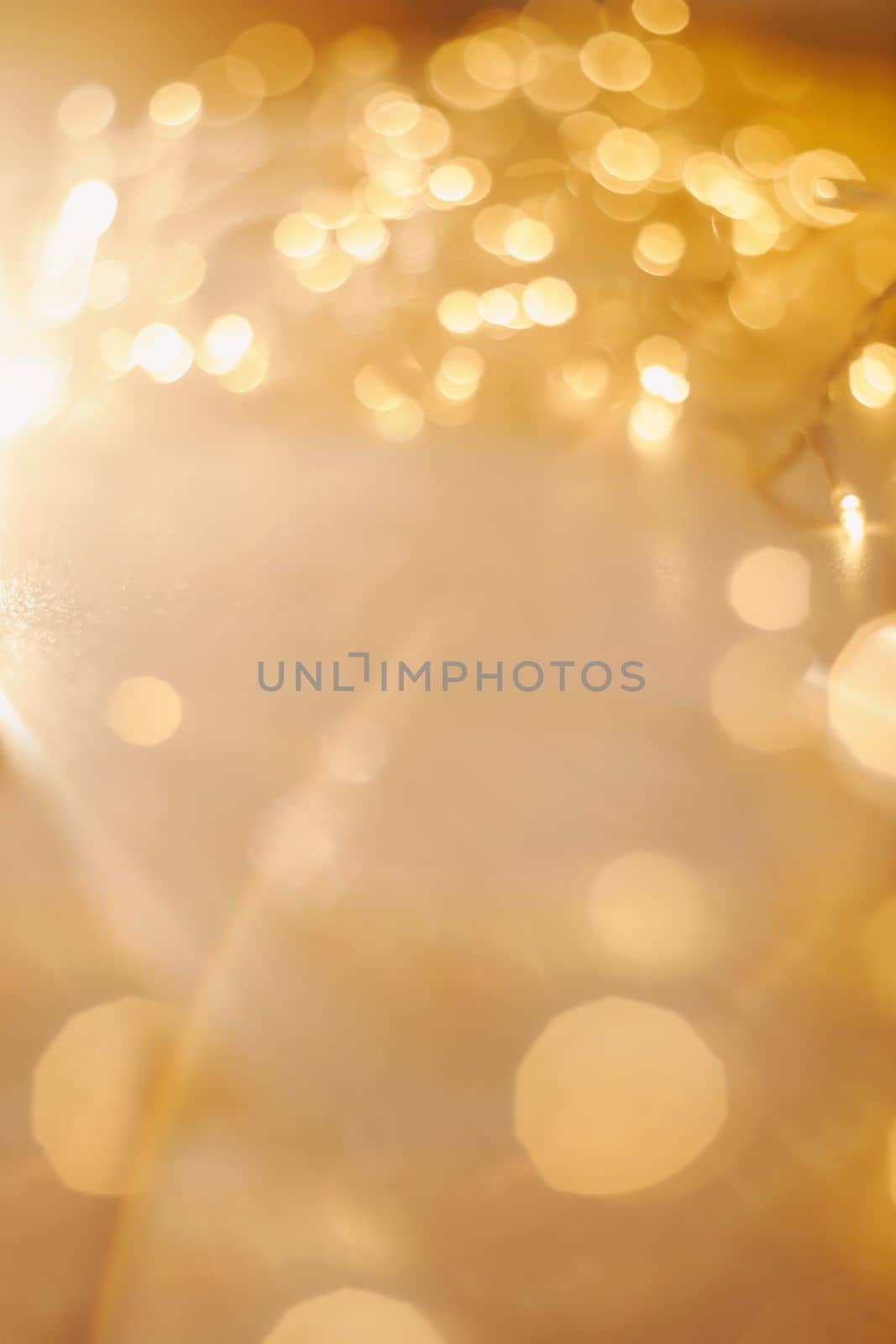 abstract shiny gold background. blured bokeh glowing golden background for design with copyspace