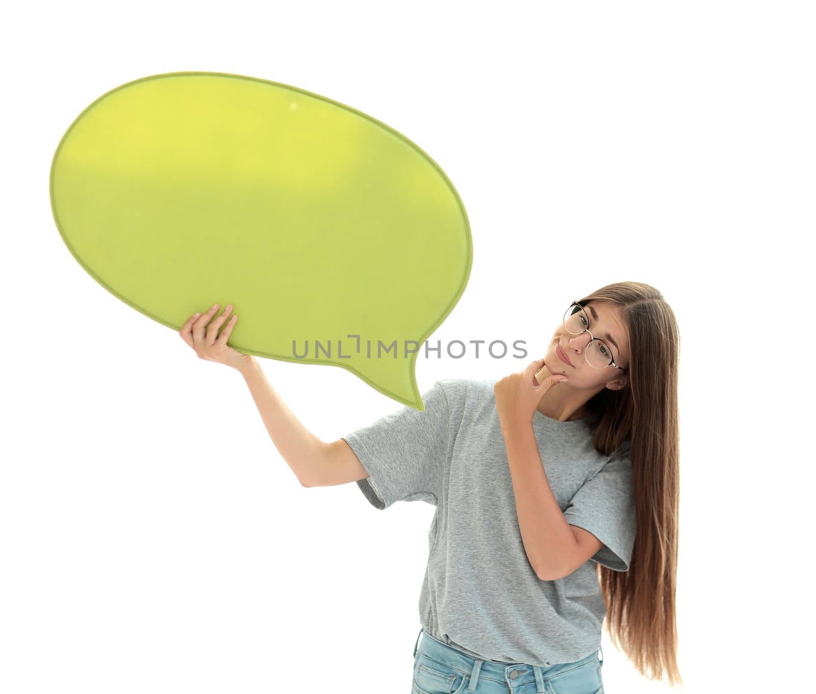 casual girl looking at the speech bubble in her hands. isolated on white