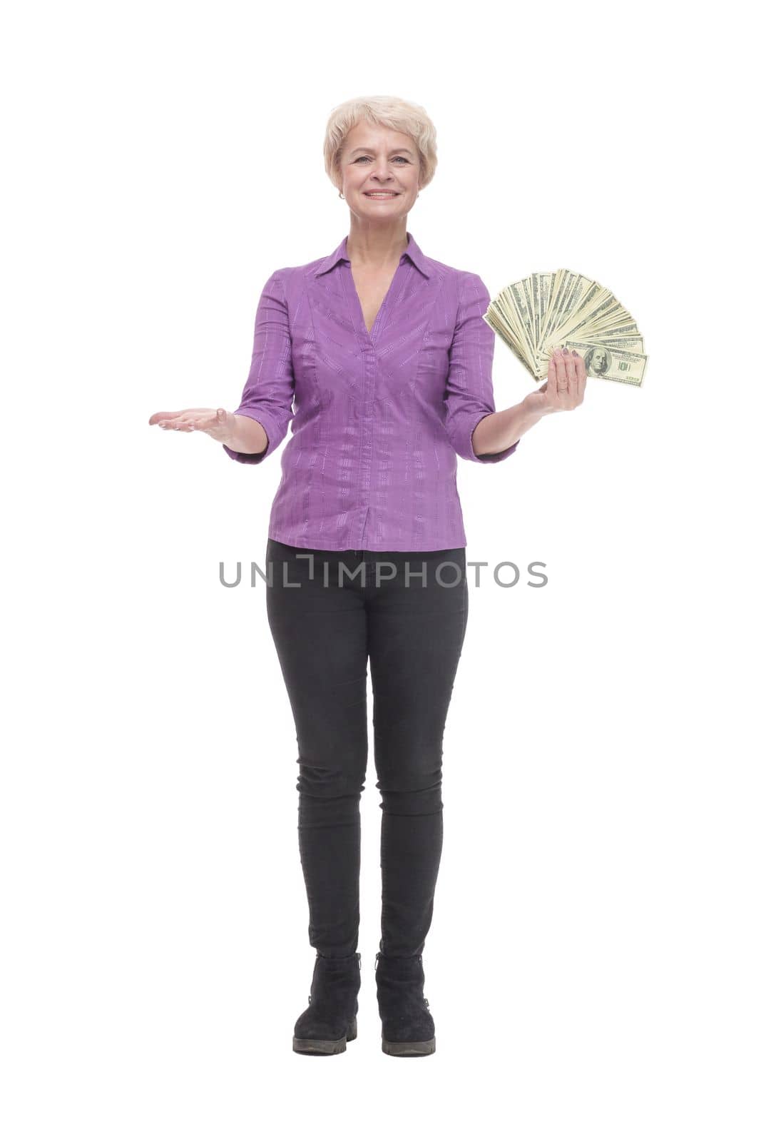 in full growth. happy mature woman with banknotes. isolated on a white background.
