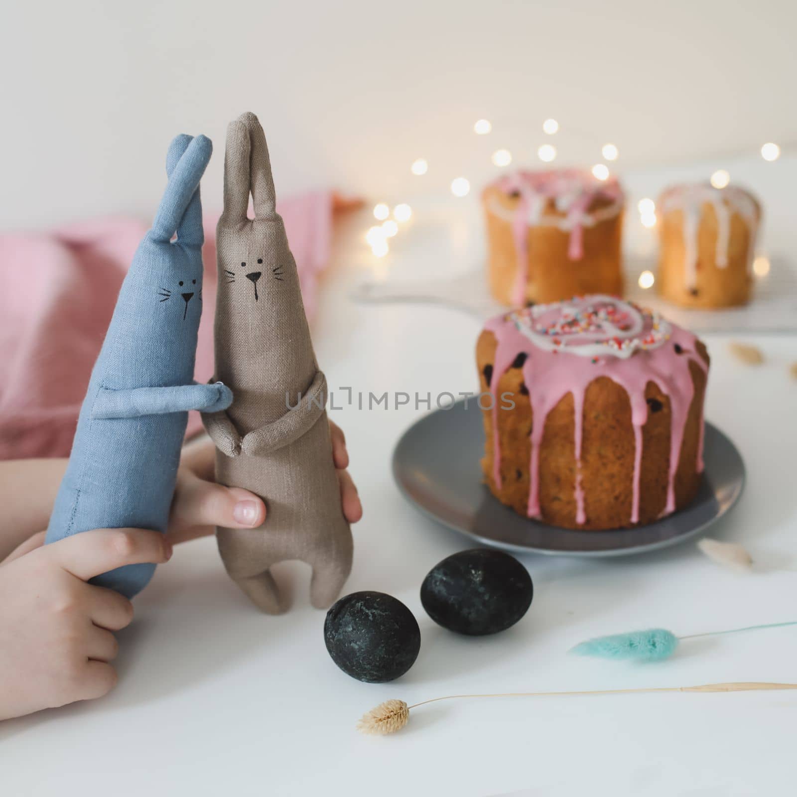 Easter cake, colorful eggs and rabbit toy. Happy Easter holiday concept. festive spring season by paralisart