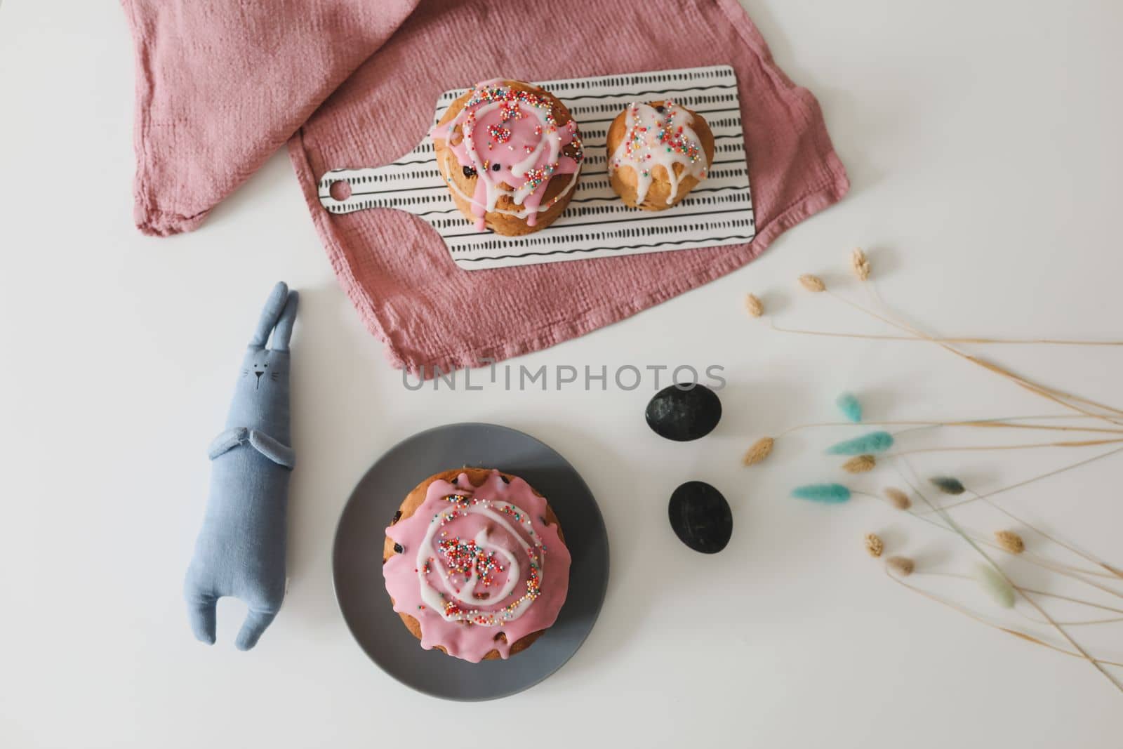 Easter cake, colorful eggs and rabbit toy. Happy Easter holiday concept. festive spring season.