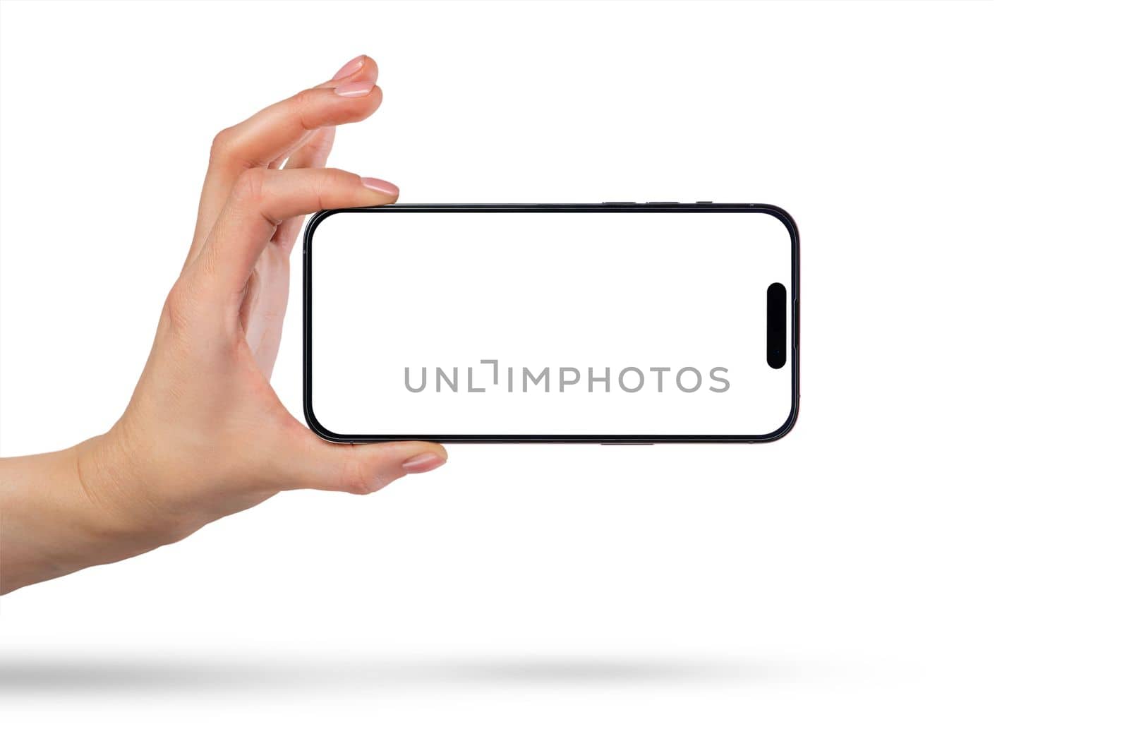 Phone in hand on a white background. A woman's hand holds a new modern phone in her hand on a white background with a blank white screen