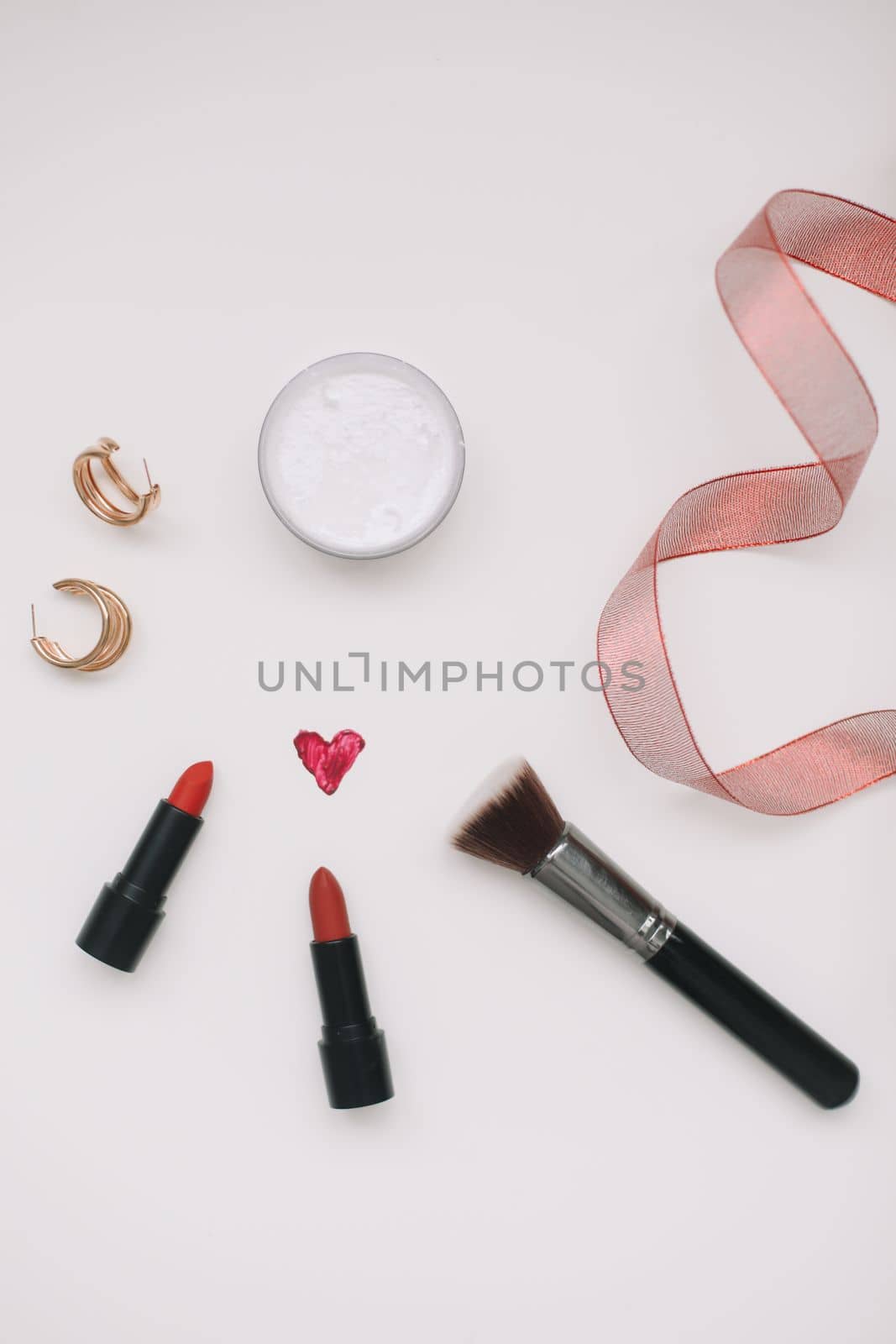 Cosmetic makeup products and accessories flatlay top view. Concept Women's Day, Valentines Day, March 8.