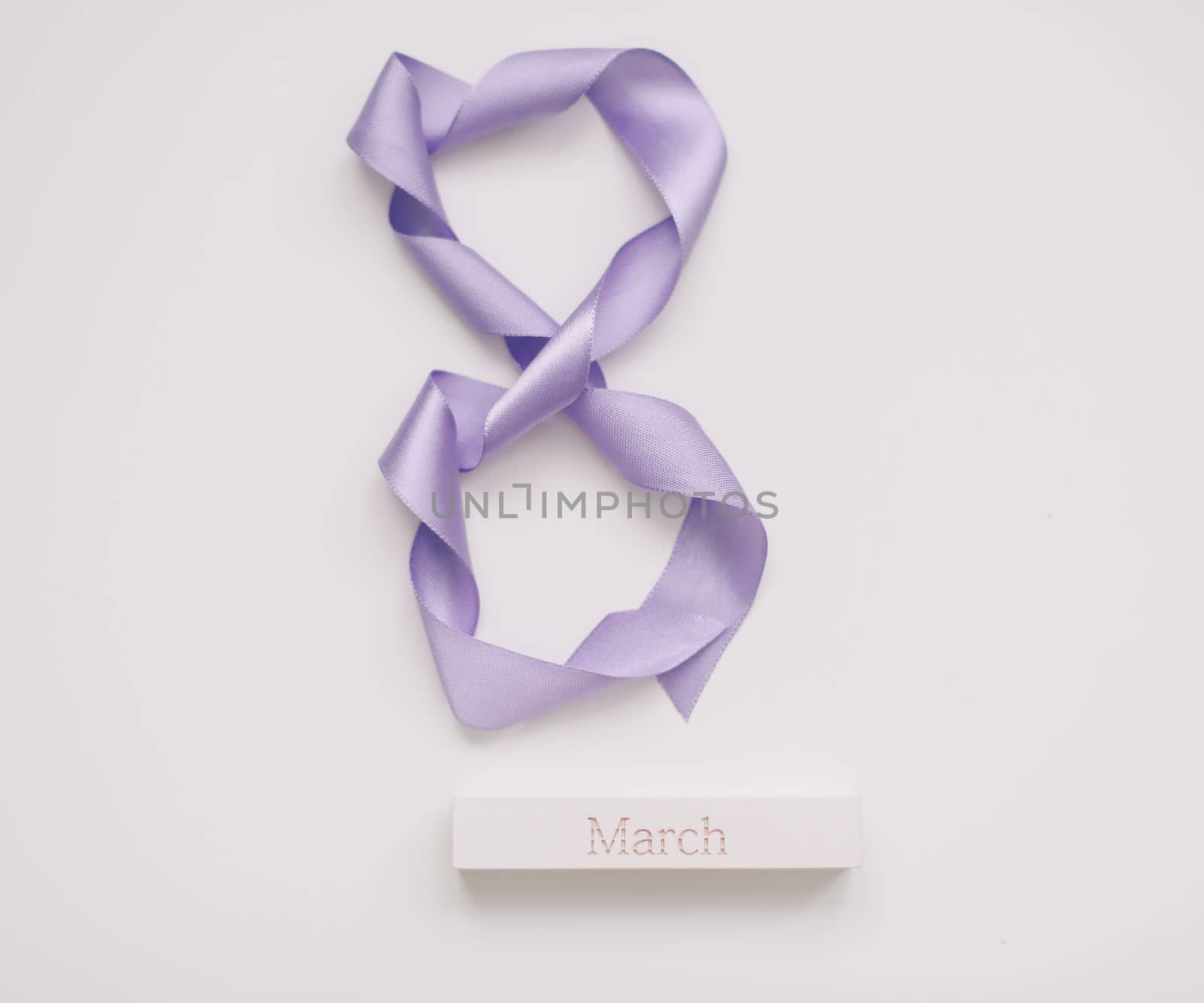 Eight made of violet ribbon. 8 March greeting card template. International Women's day background, banner, poster or brochure.