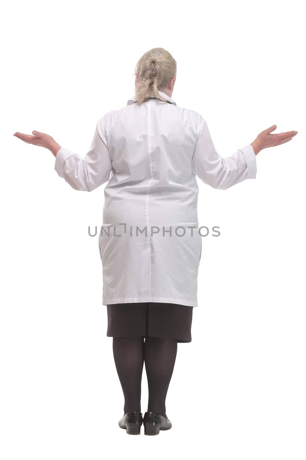 Back view of a female doctor looking at white. Full length shot