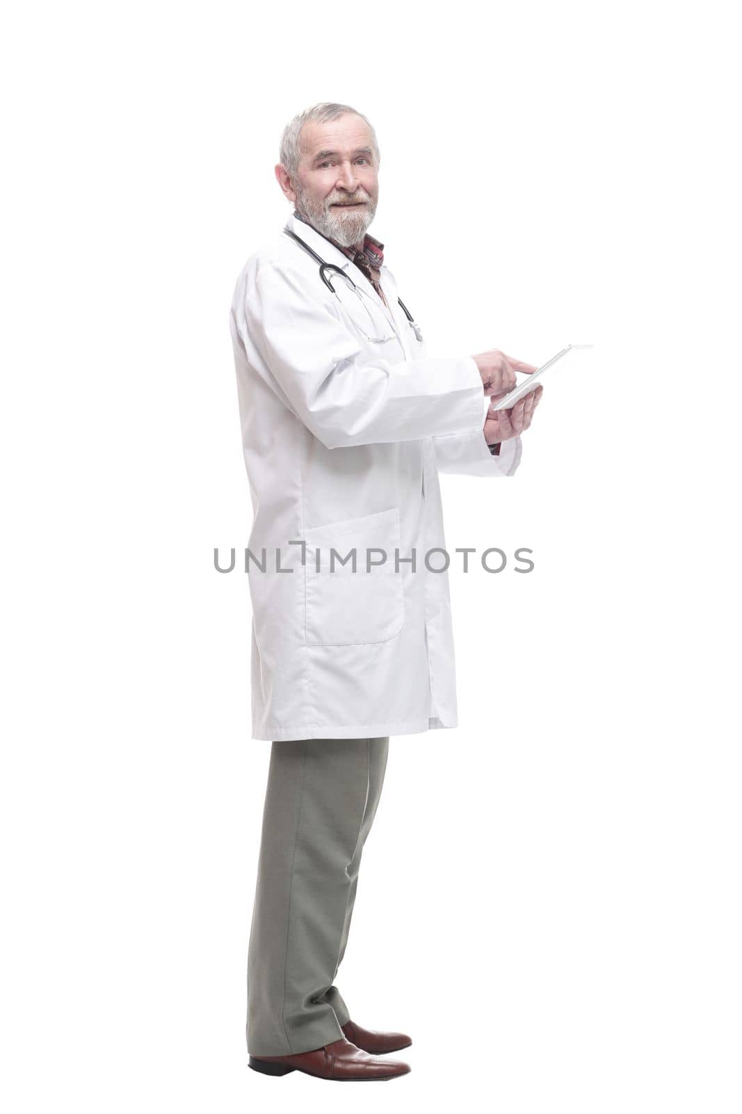 elderly competent doctor with a digital tablet. isolated on a white background.