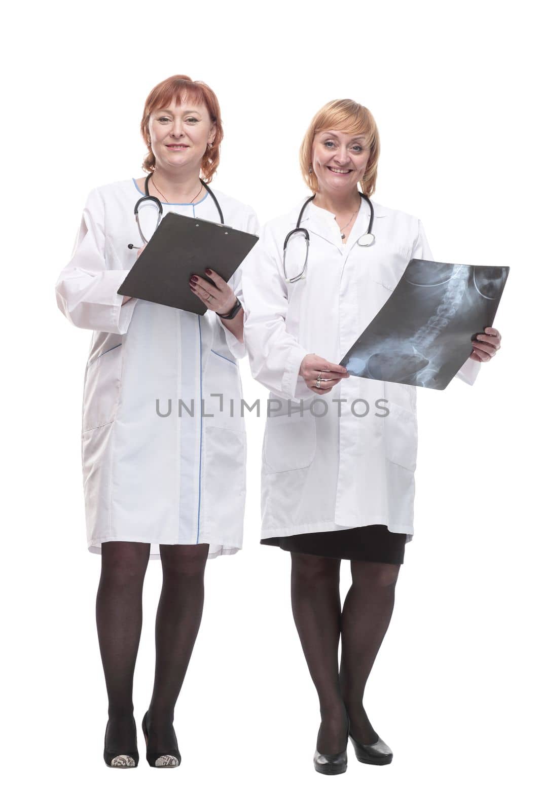 in full growth. two female doctors with x-rays. by asdf