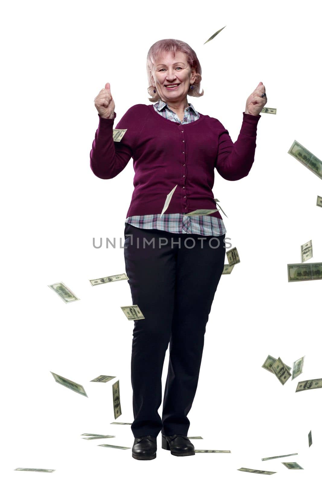 in full growth. an adult woman looking at banknotes in her hands. isolated on a white