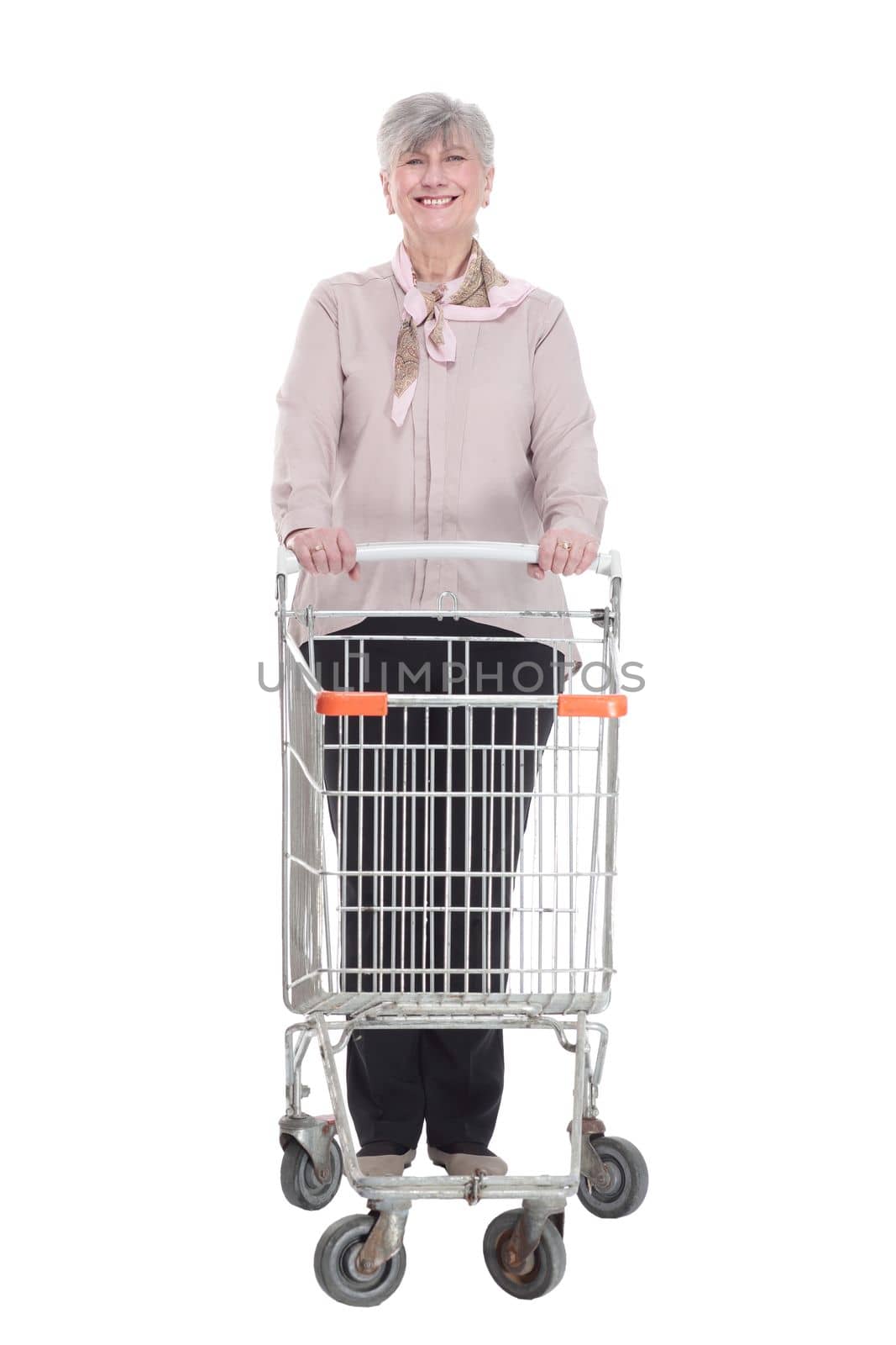 in full growth. smiling old lady with a shopping cart . isolated on a white background.