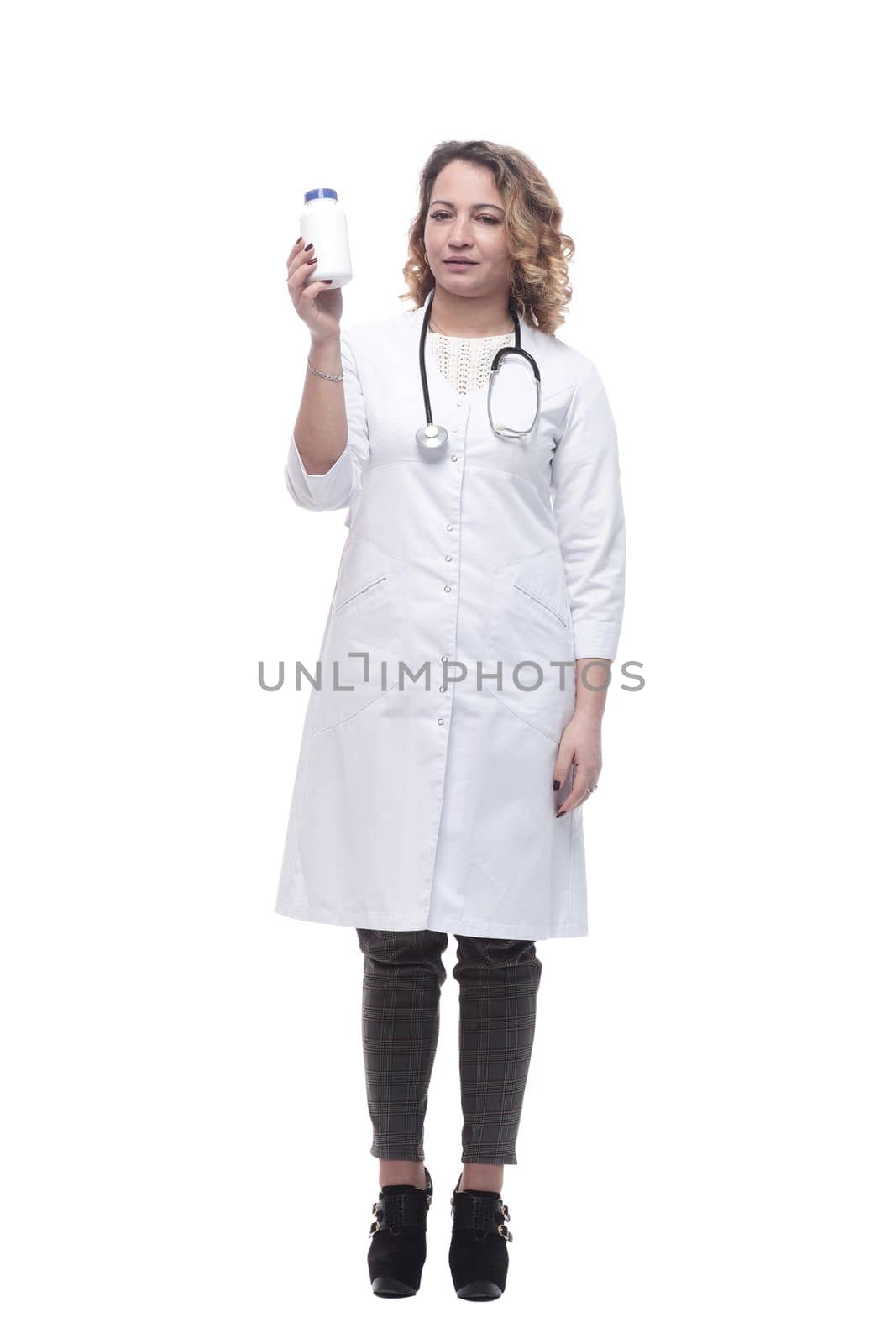 in full growth.young woman doctor showing her business card. isolated on a white background.