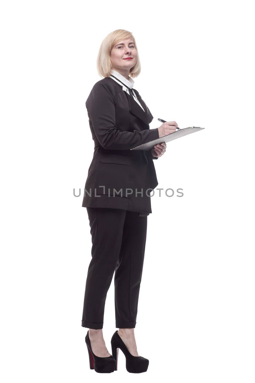 in full growth. confident business woman with a clipboard. isolated on a white background.