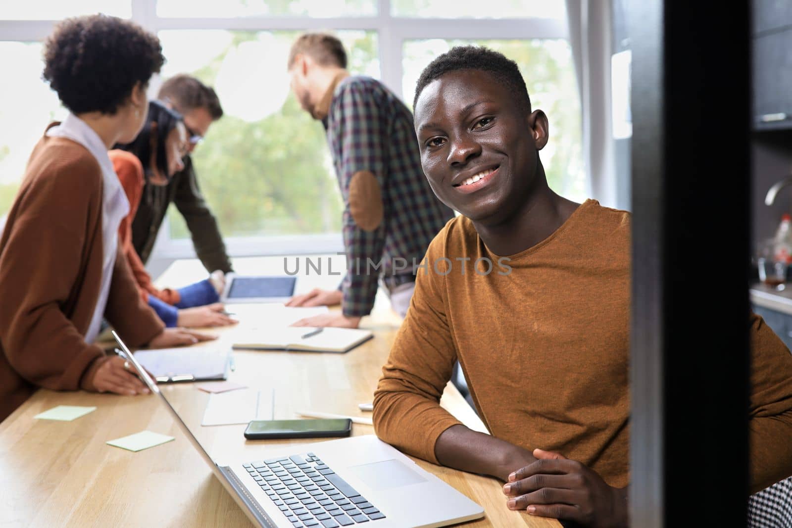 african american businessman working on laptop computer in office