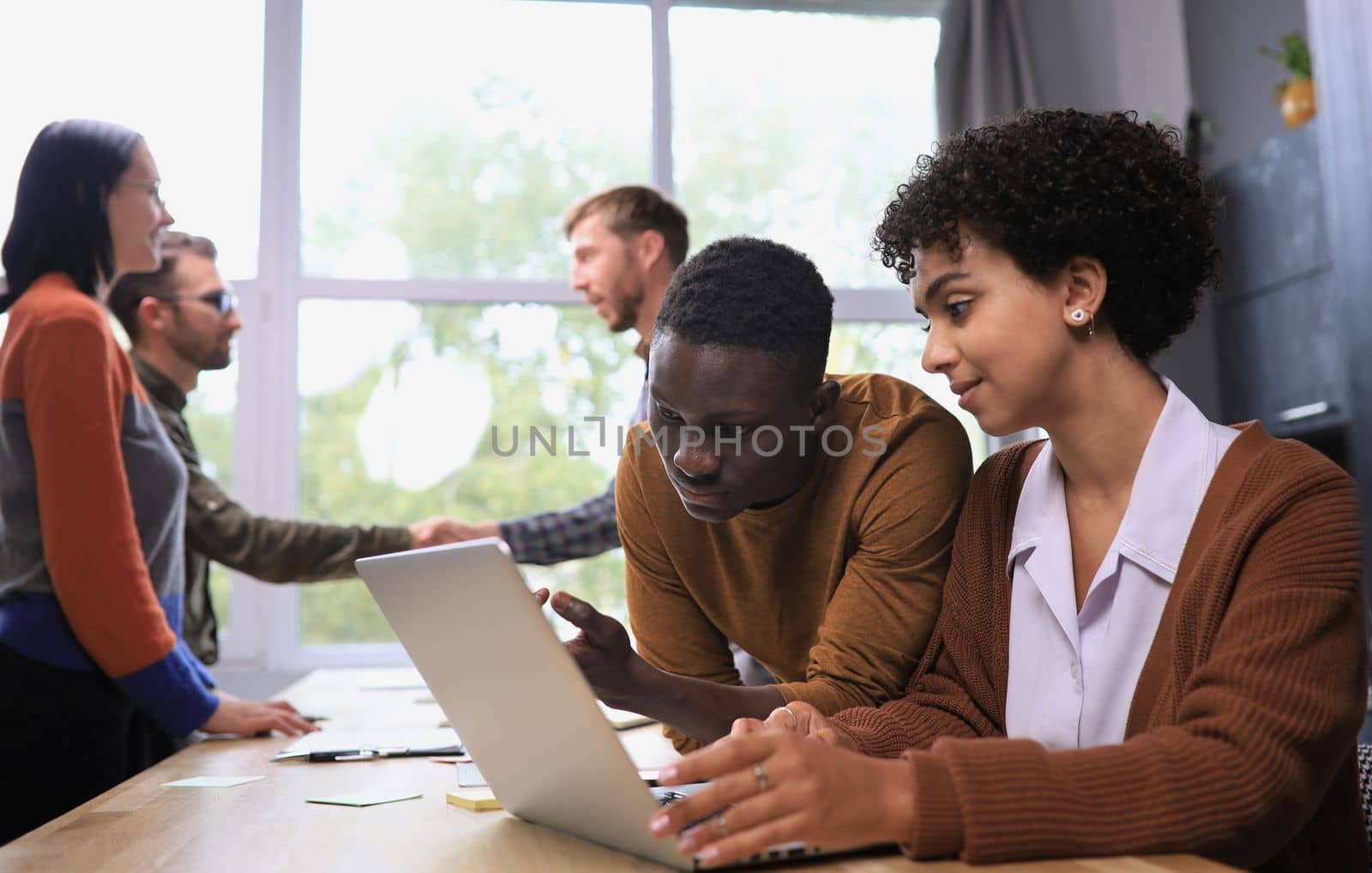 business concept. professional man and woman are discussing a new project. team in the background