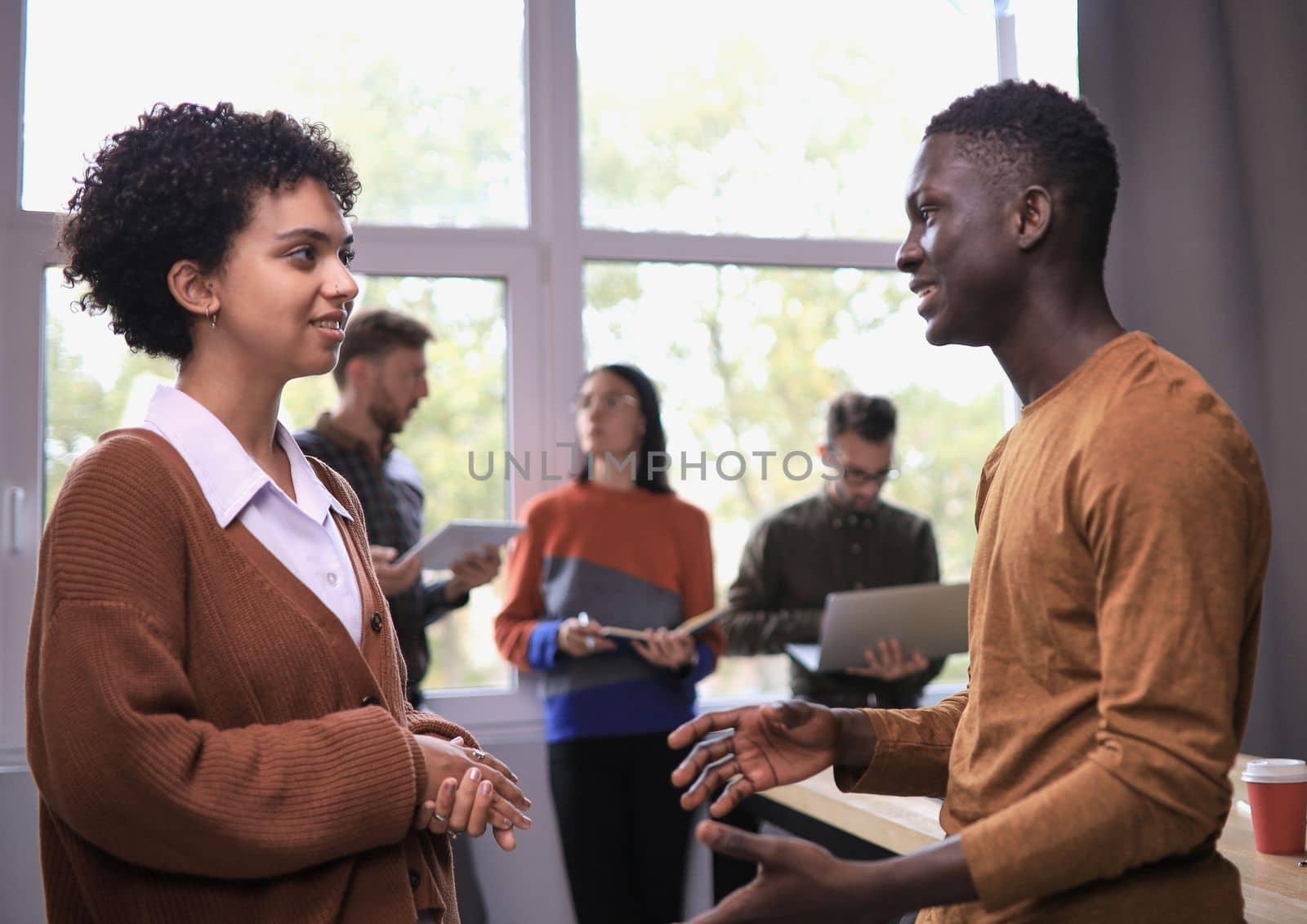 business concept. professional man and woman are discussing a new project. team in the background