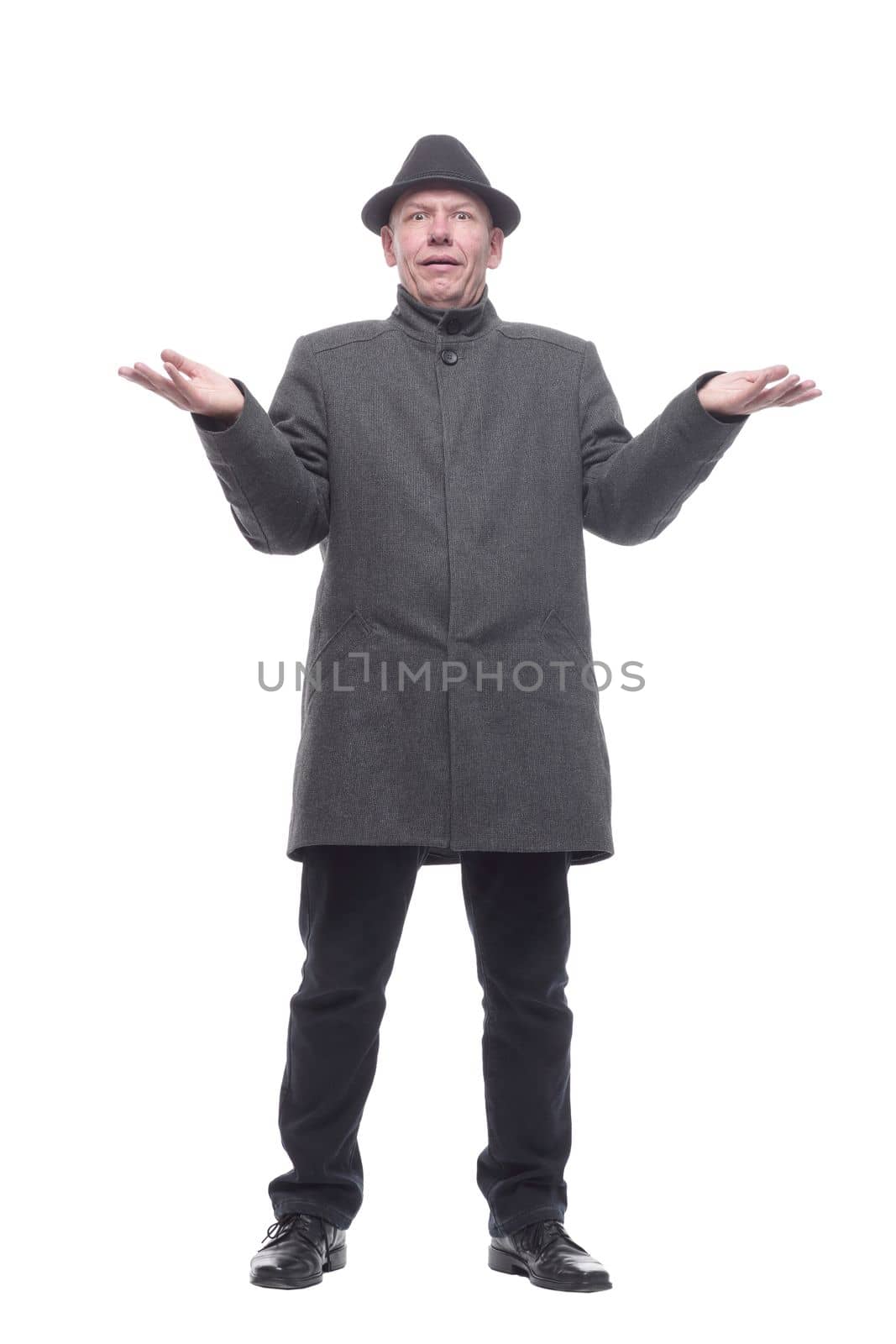 emotional man in a hat and autumn coat . isolated on a white background.
