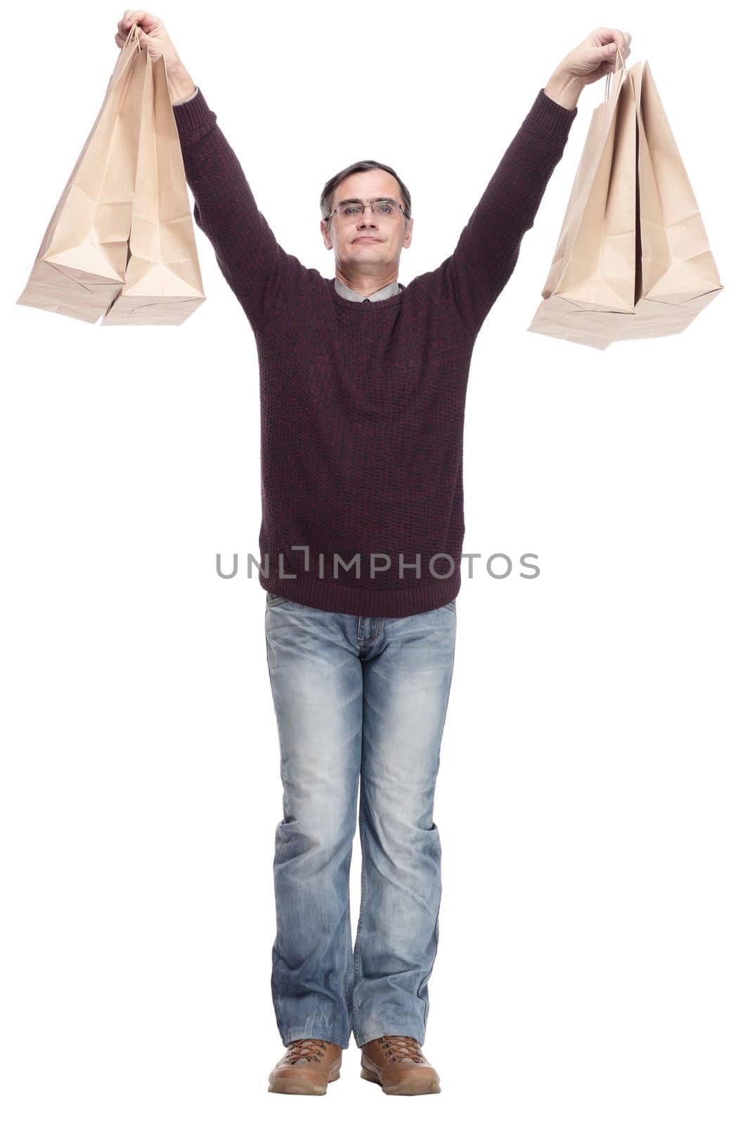 full-length. casual man with shopping bags. isolated on a white background.