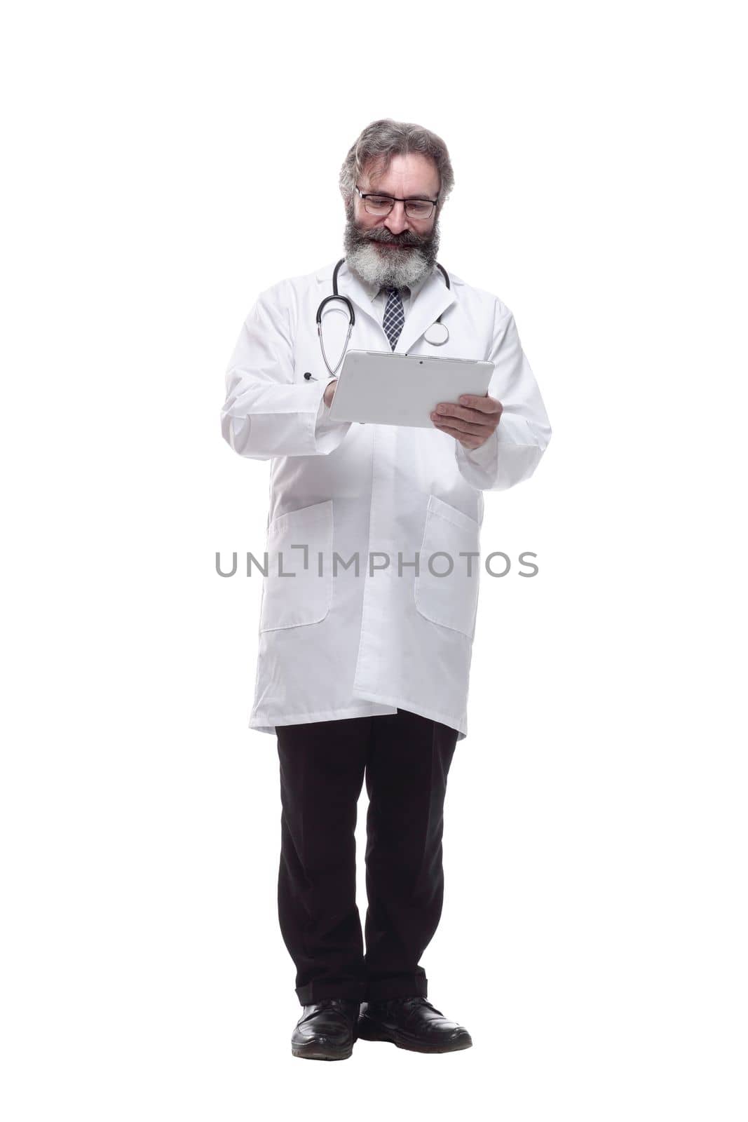 in full growth. doctor therapist pointing to the form in the clipboard. isolated on a white background