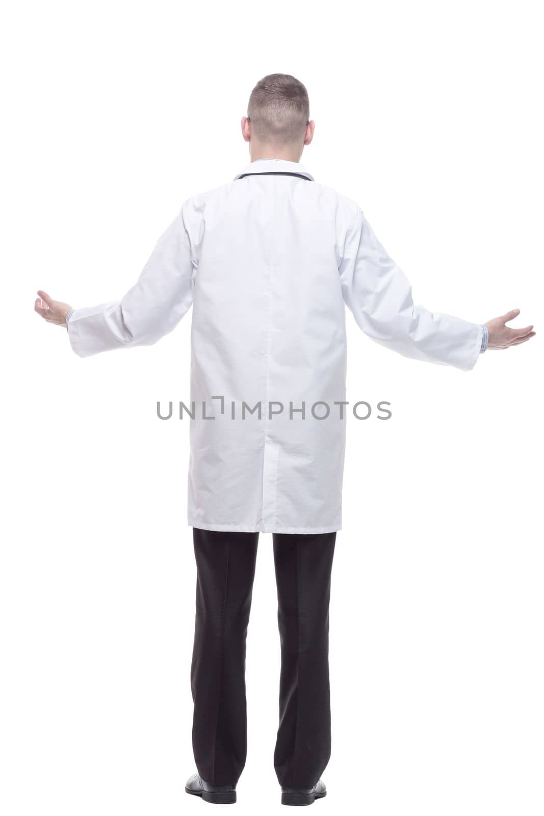 rear view. confident doctor with a stethoscope. isolated on a white background.