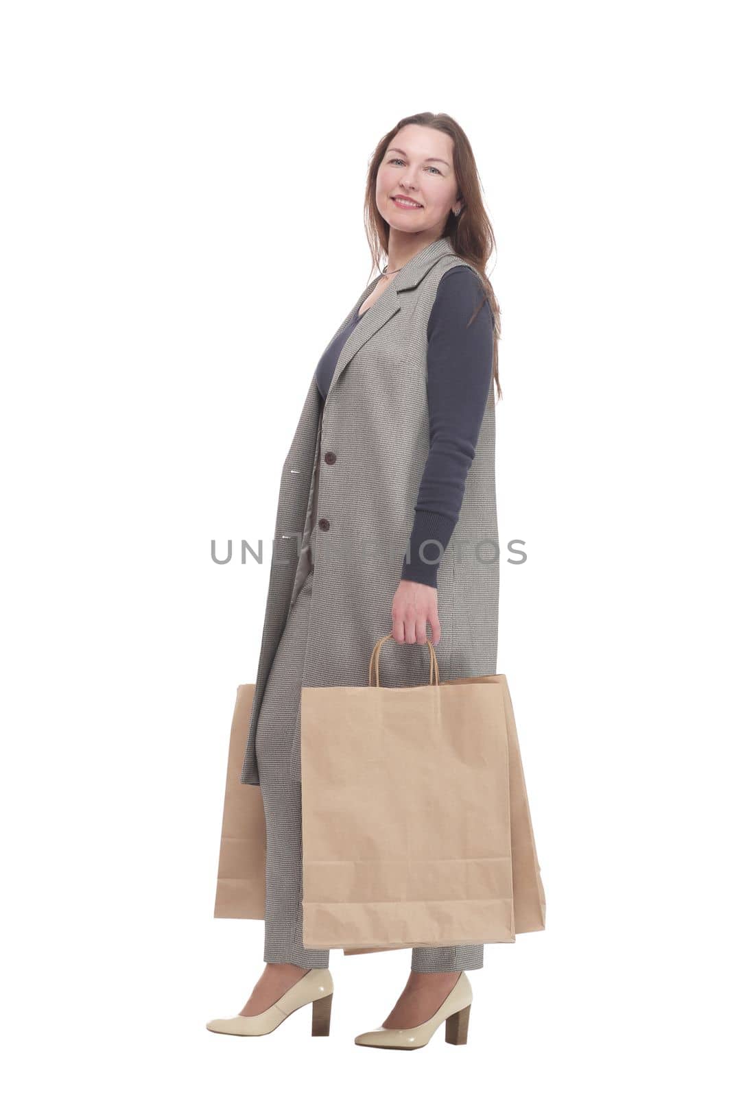 in full growth. elegant woman with shopping bags.isolated on a white background.