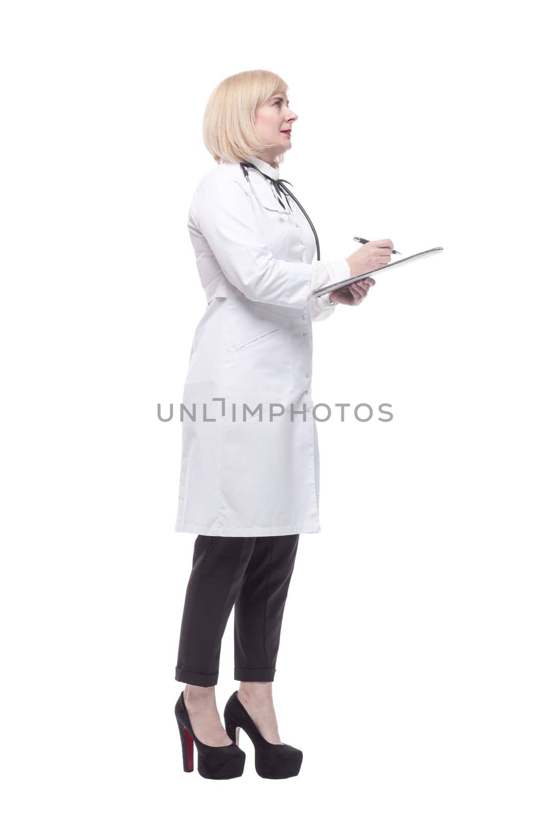 in full growth.qualified female doctor with clipboard. isolated on a white background.