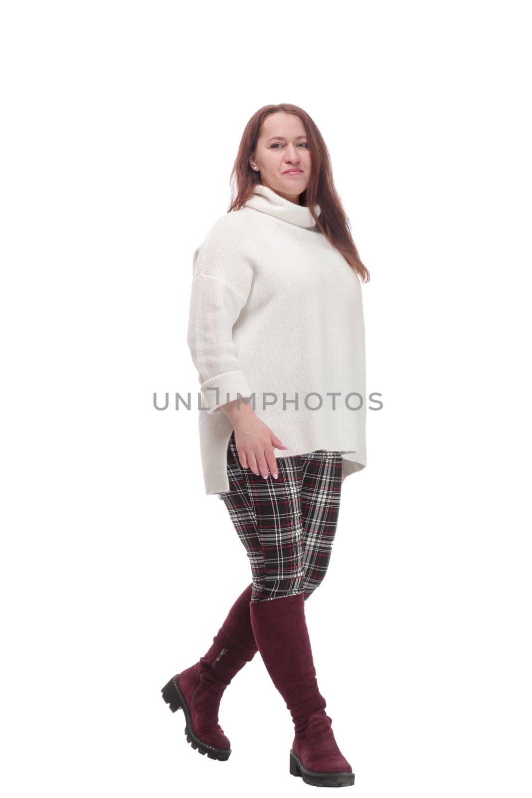 full-length. woman in casual clothes walking forward .isolated on a white background.