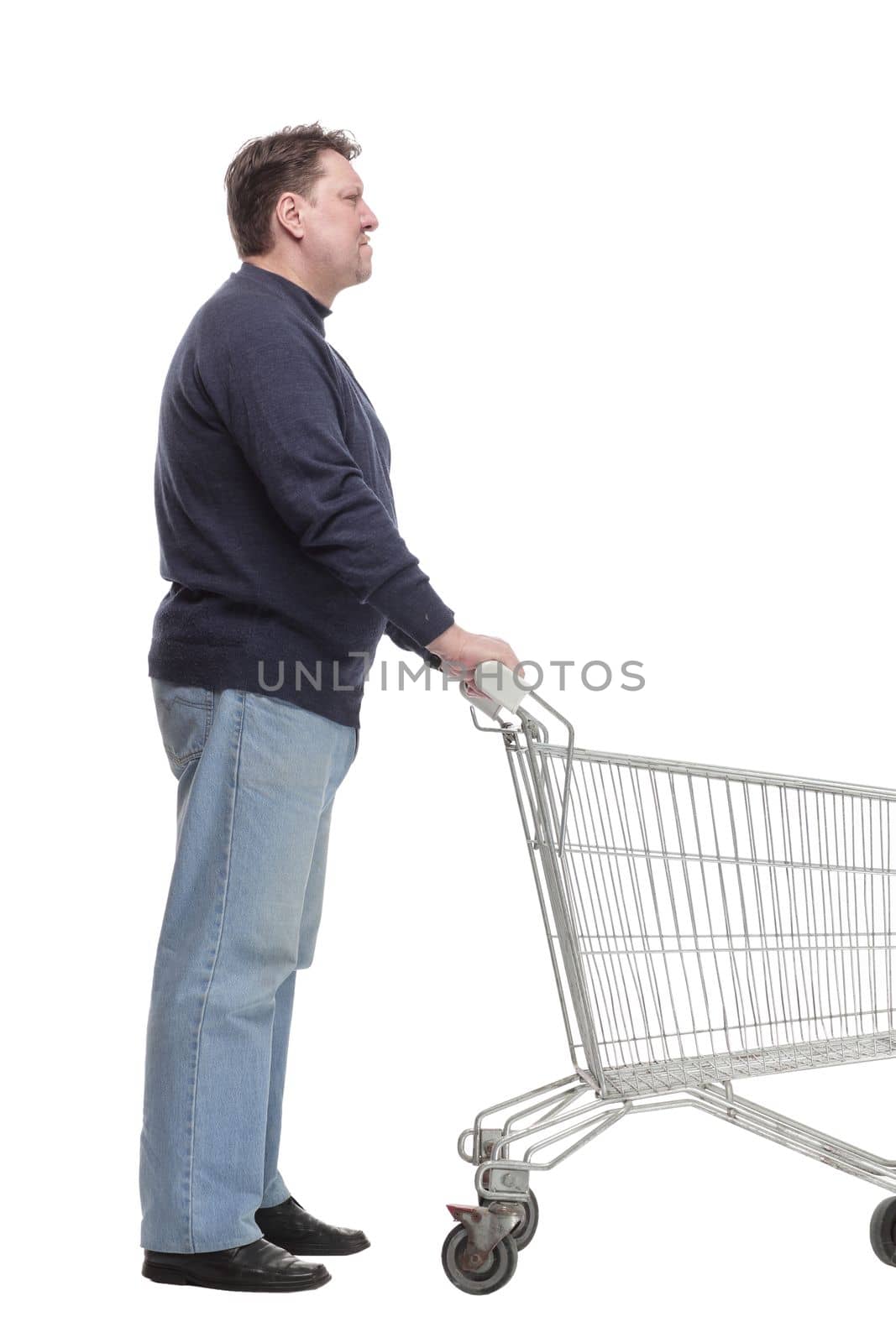 in full growth. casual mature man with shopping cart . by asdf