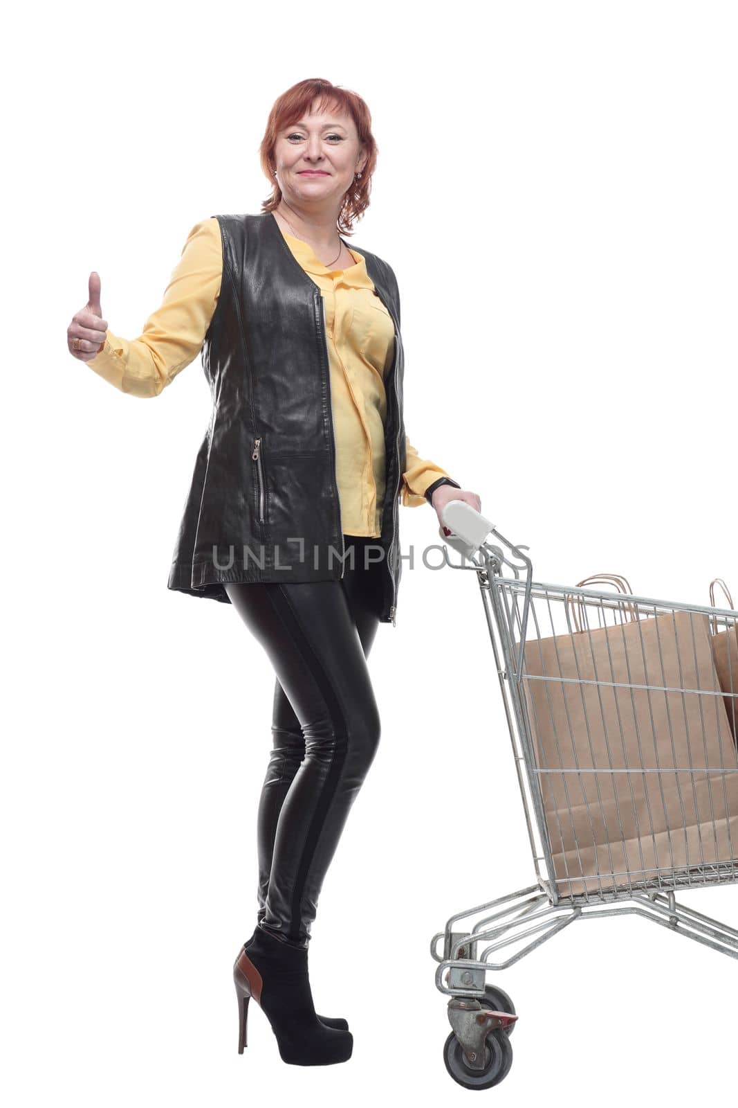 happy mature woman with shopping cart. isolated on a white by asdf