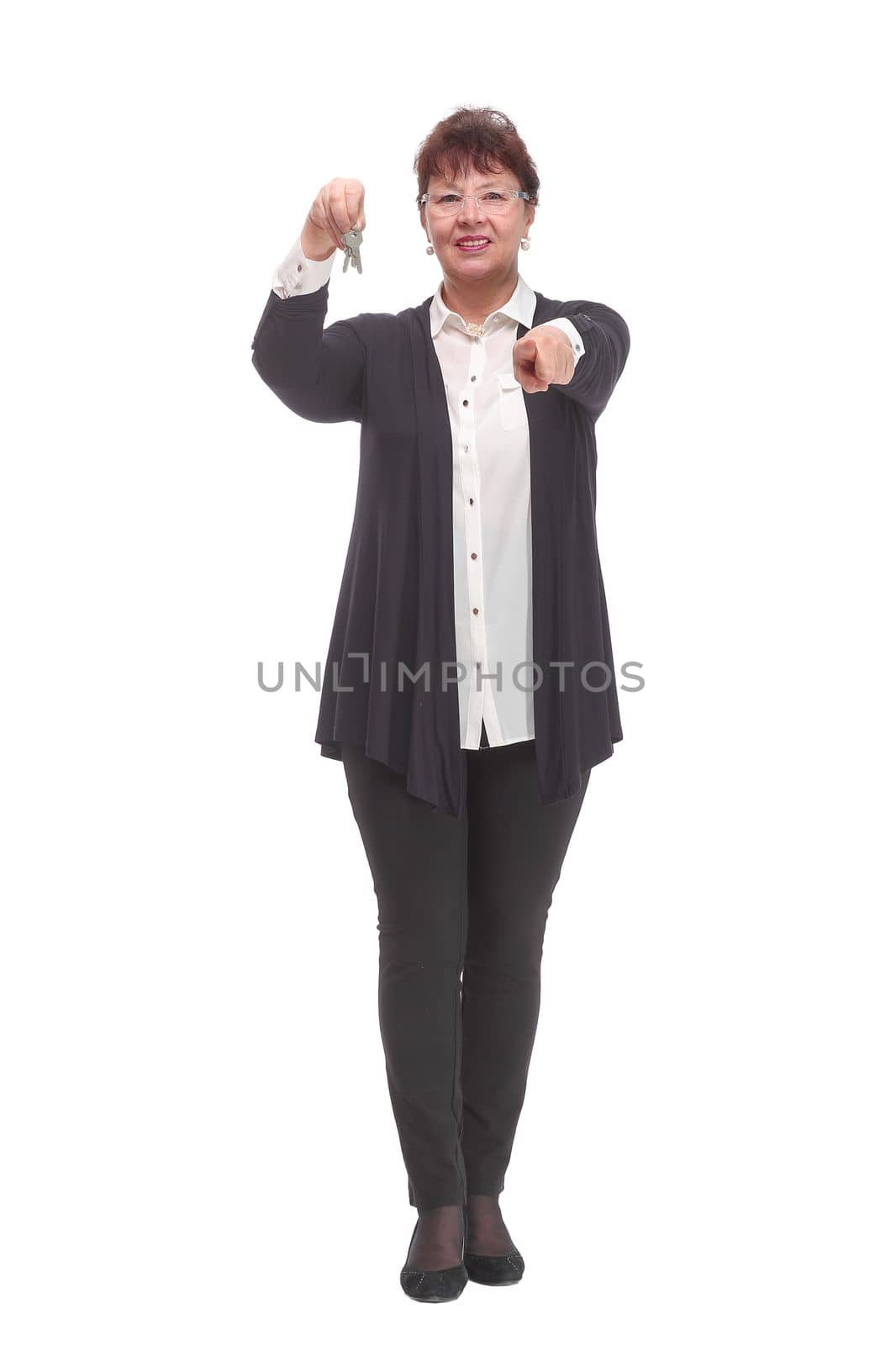 mature woman holding a couple of keys of her new house or home or some property by asdf