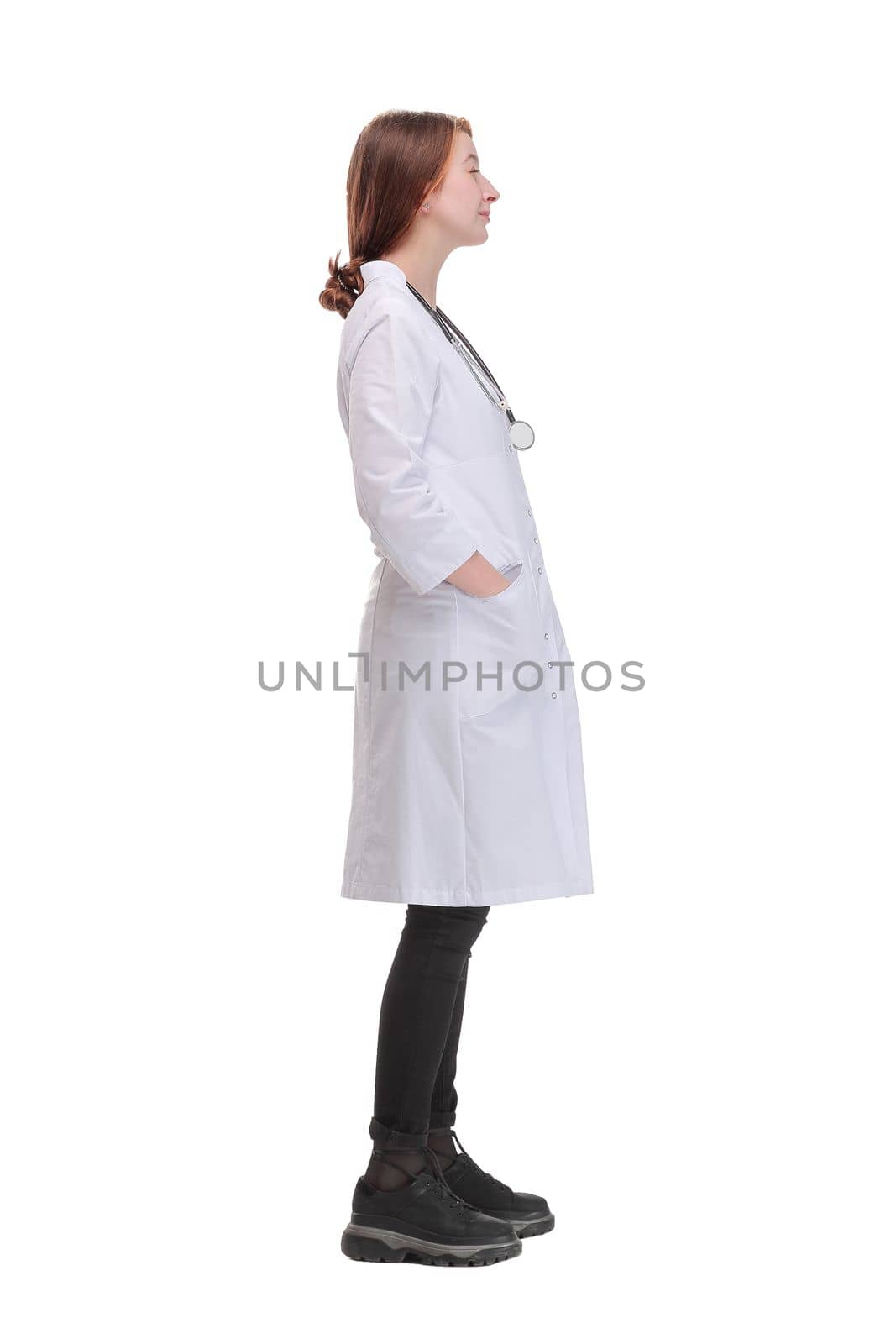 Beautiful young doctor woman wearing white coat over isolated background looking to camera by asdf