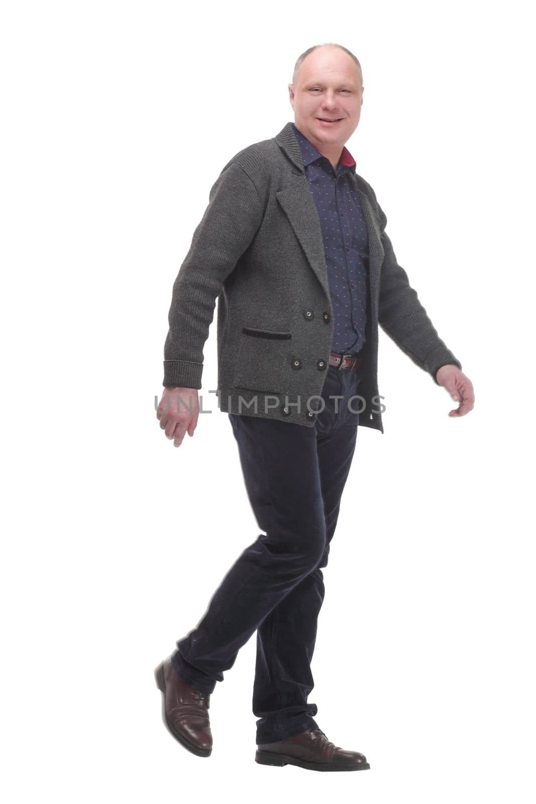 Mature man in casual clothes striding forward. by asdf