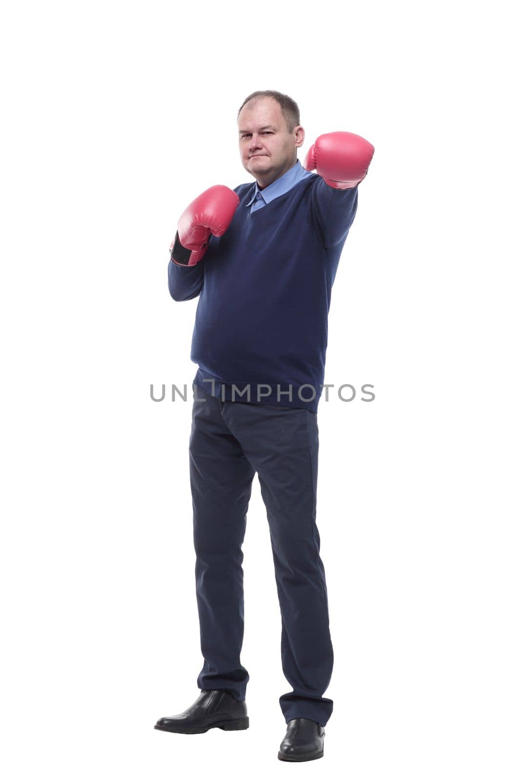 in full growth. Mature man in Boxing gloves. isolated on a white background.